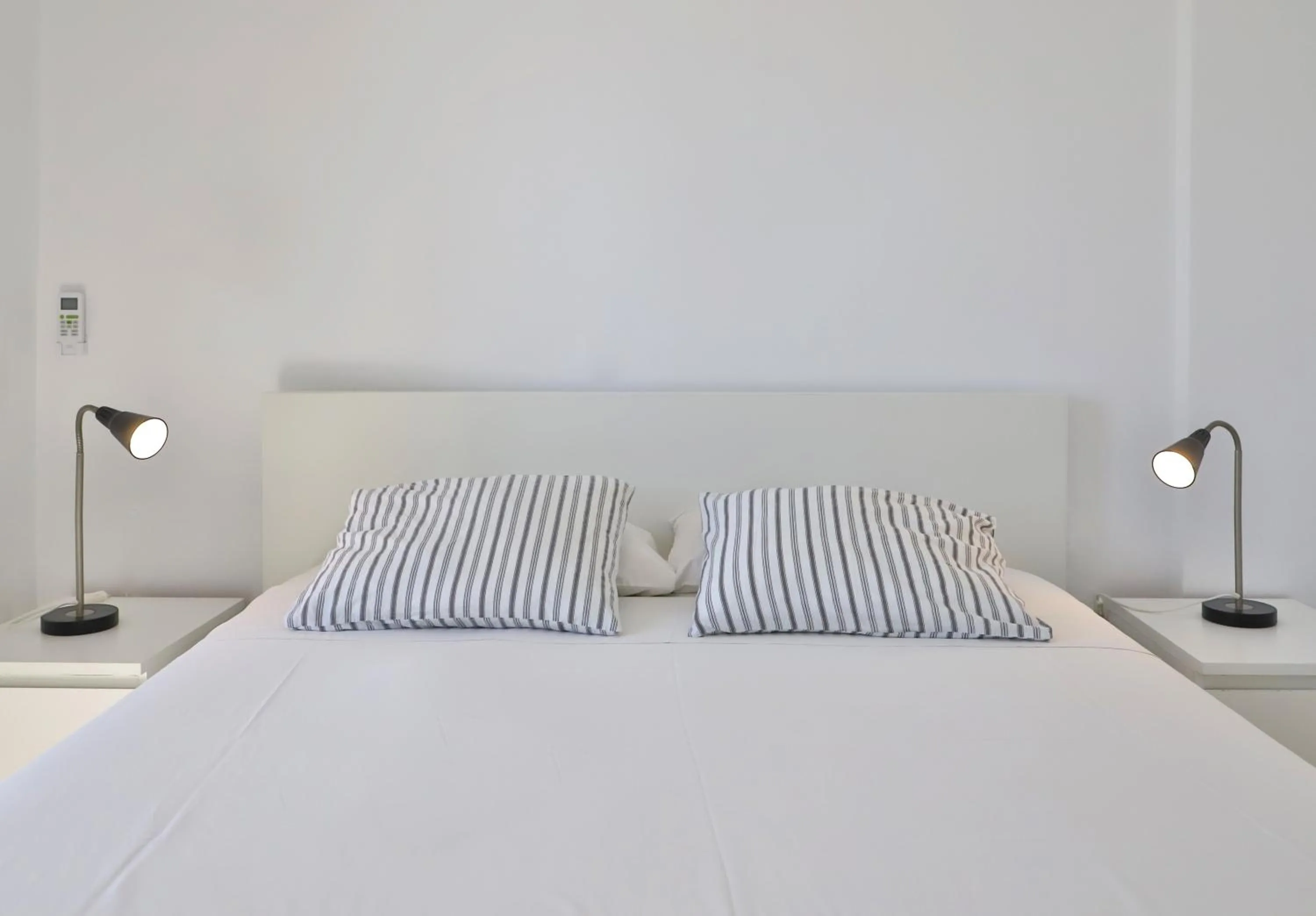 Bed in Helios Studios & Apartments