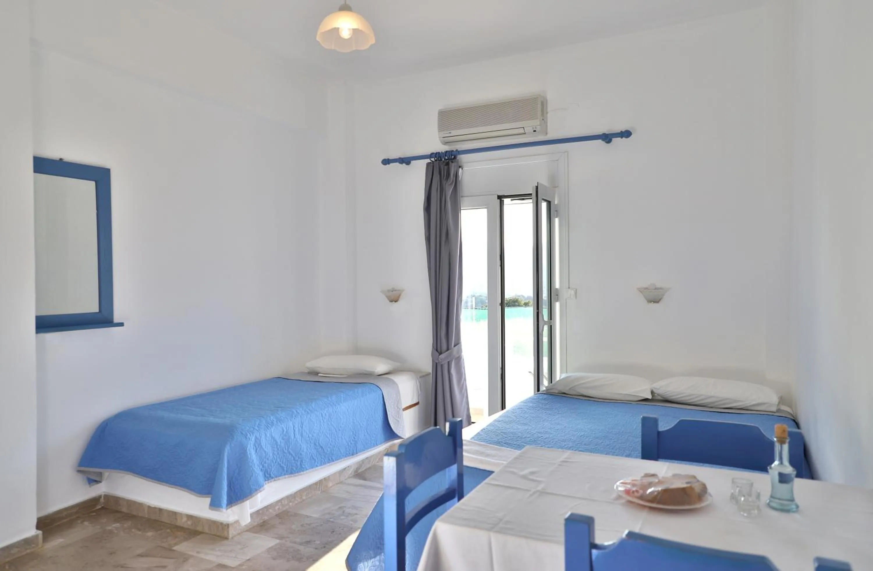 Bed in Helios Studios & Apartments