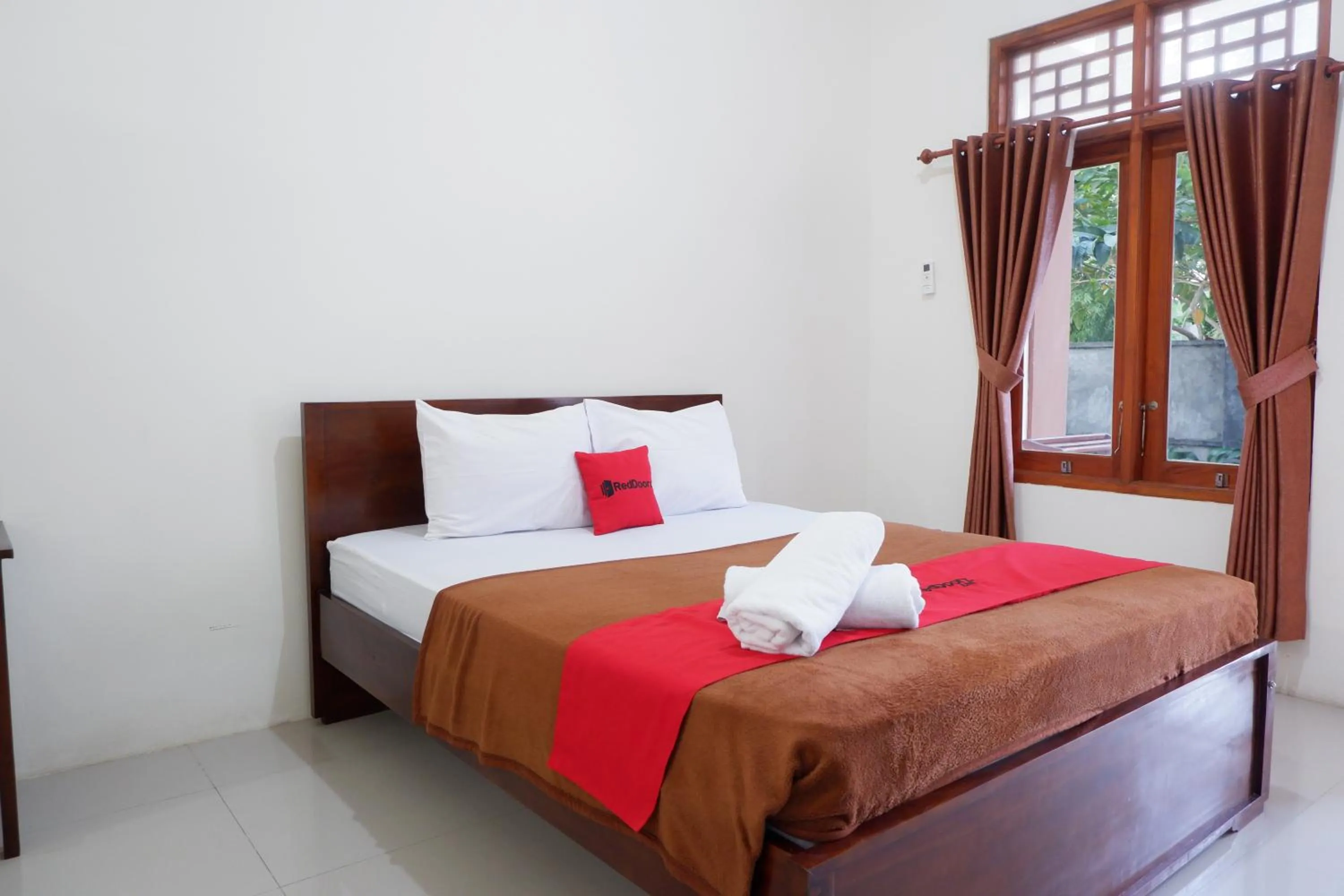 Bed in Reddoorz at Bale Eja Syariah Senggigi