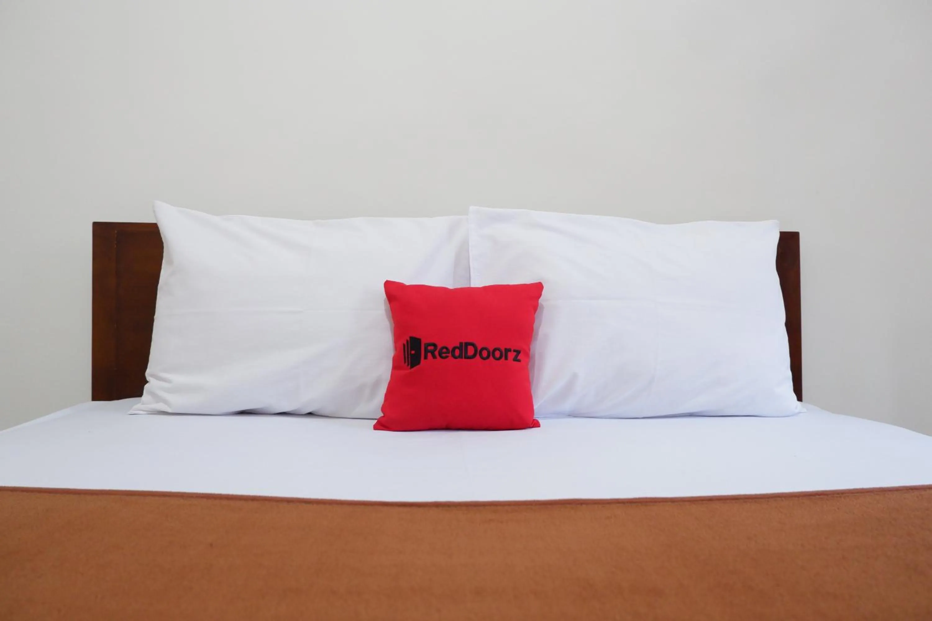 Bed in Reddoorz at Bale Eja Syariah Senggigi