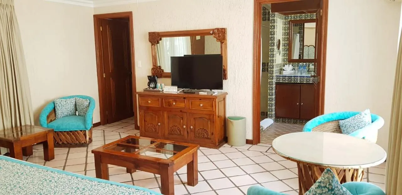 Communal lounge/ TV room in Hotel Posada Quinta Las Flores