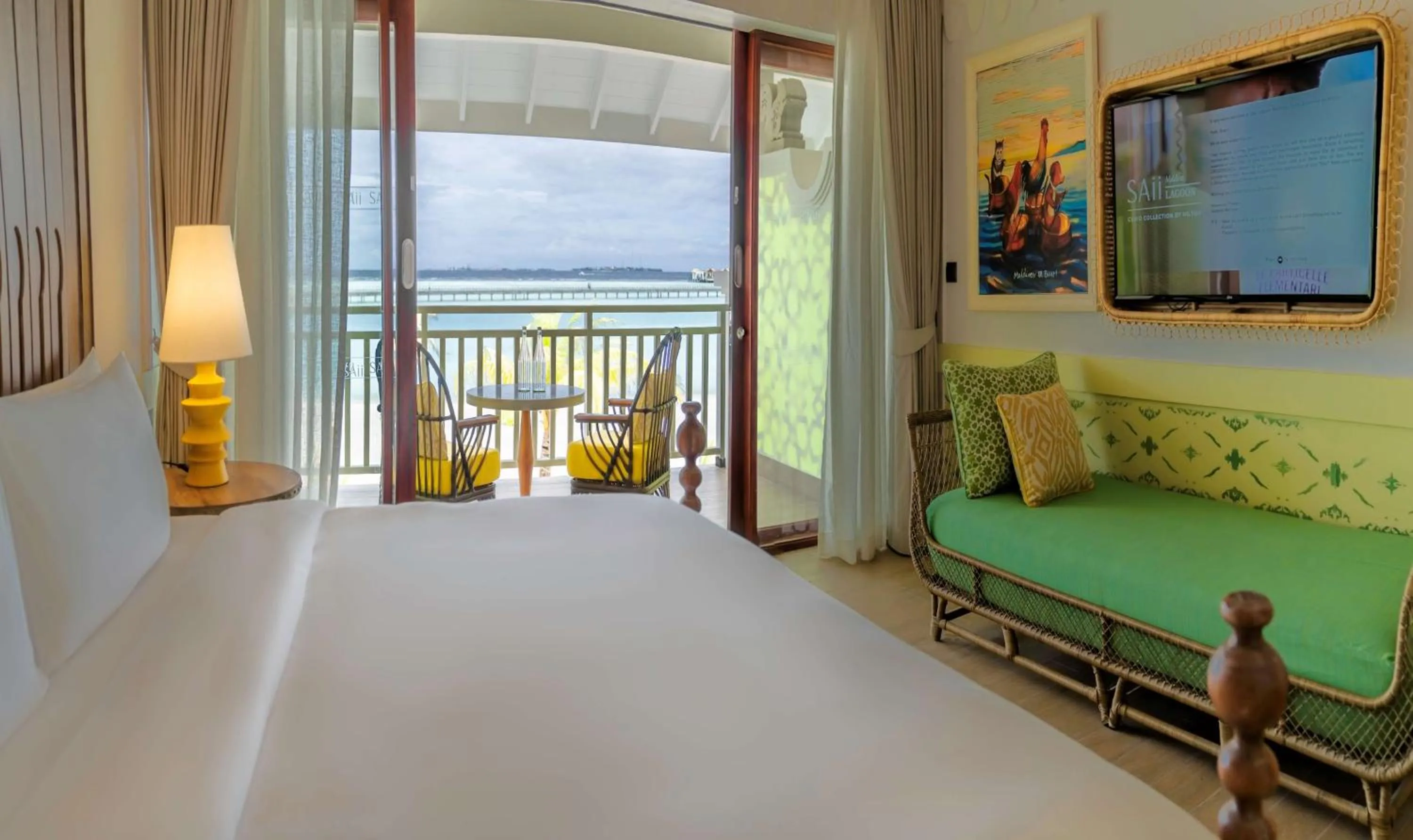 Living room, Bed in SAii Lagoon Maldives, Curio Collection By Hilton