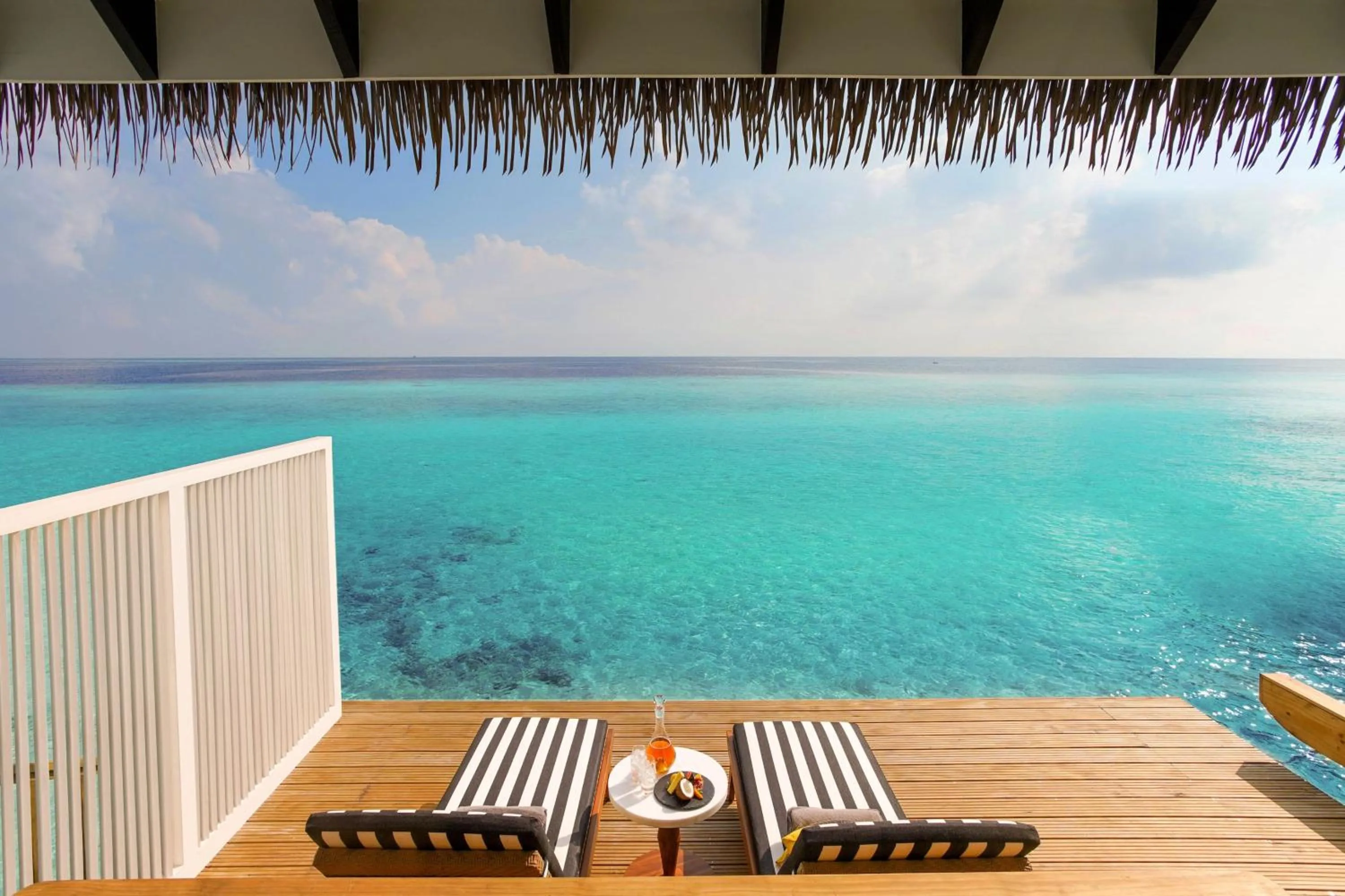 Patio in SAii Lagoon Maldives, Curio Collection By Hilton