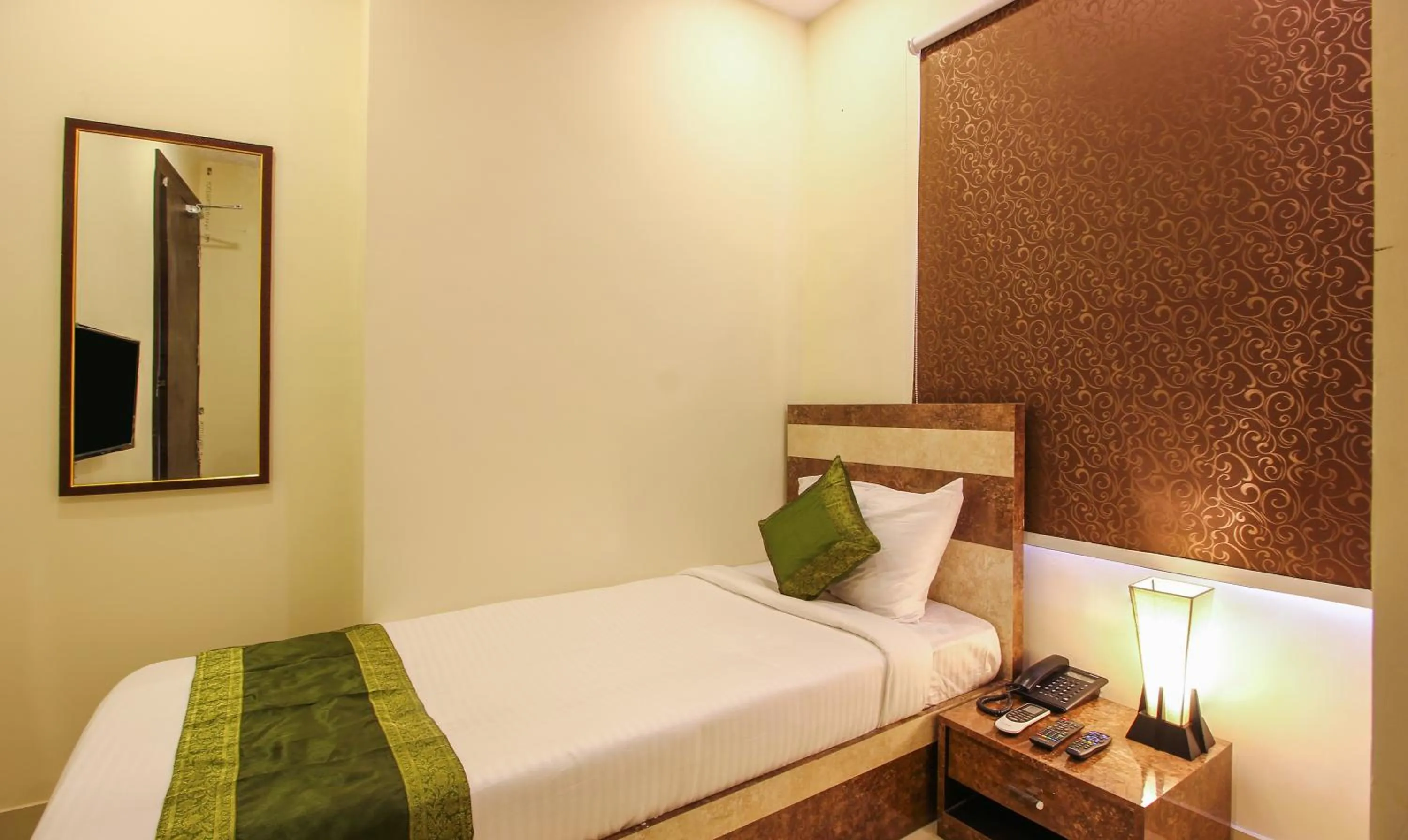 Bedroom, Bed in Treebo Address Inn, Banjara Hills