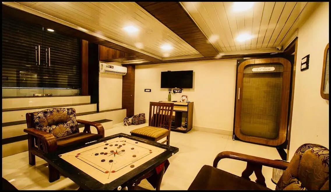 Communal lounge/ TV room in Qubestay Airport Capsule Hotel & Hostel