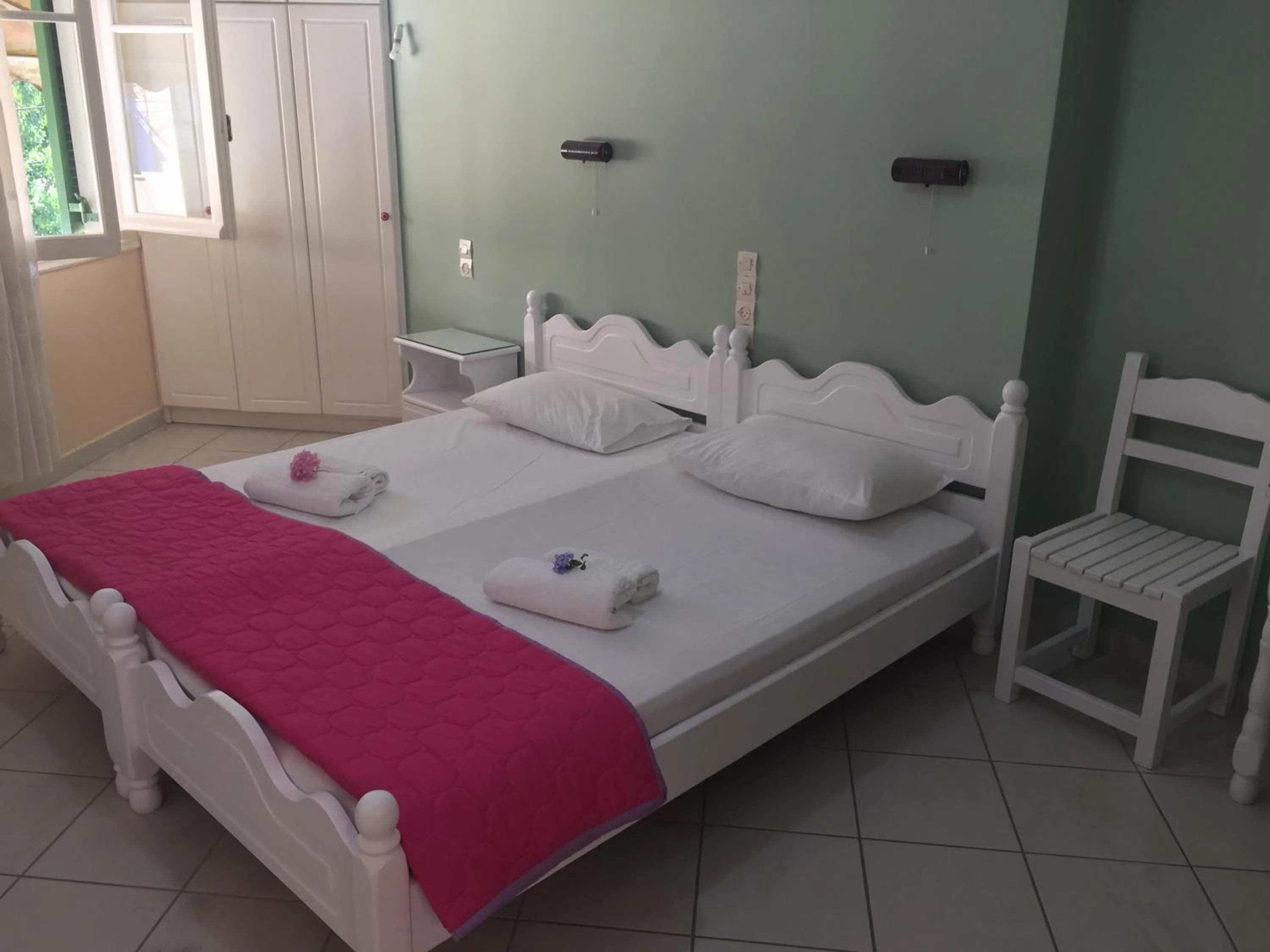 Bed in Georgakis George Rooms