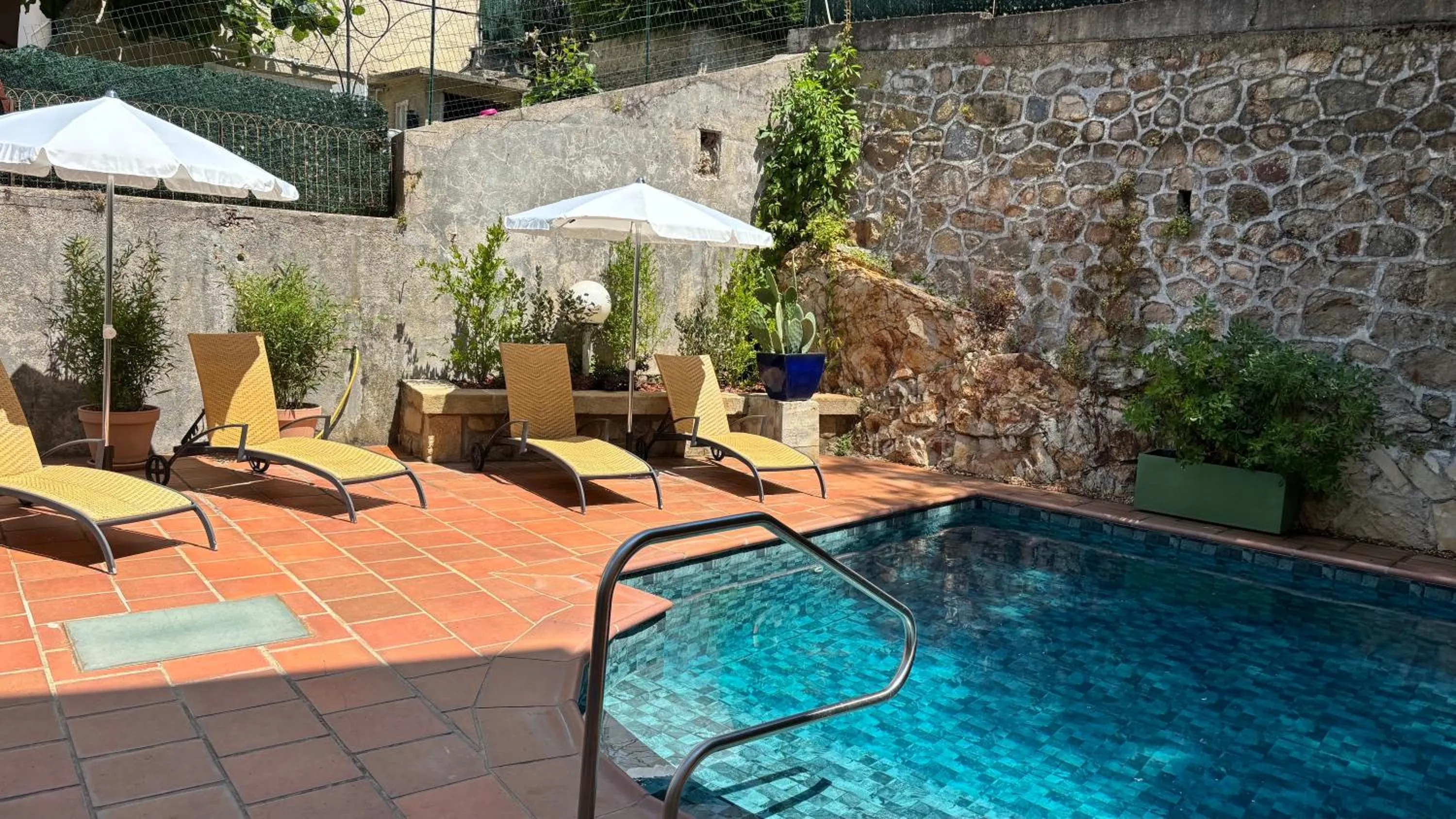 Swimming pool in Logis Hôtel Restaurant Grand Hôtel de Lyon