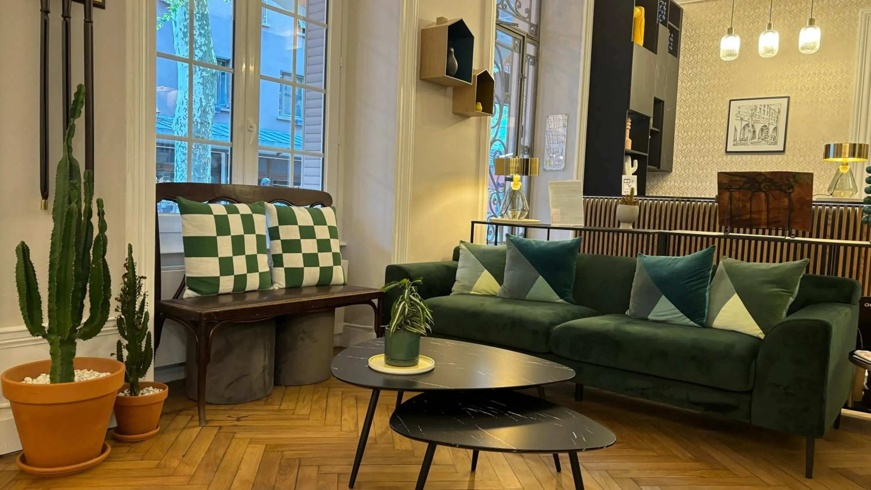 Seating area in Logis Hôtel Restaurant Grand Hôtel de Lyon