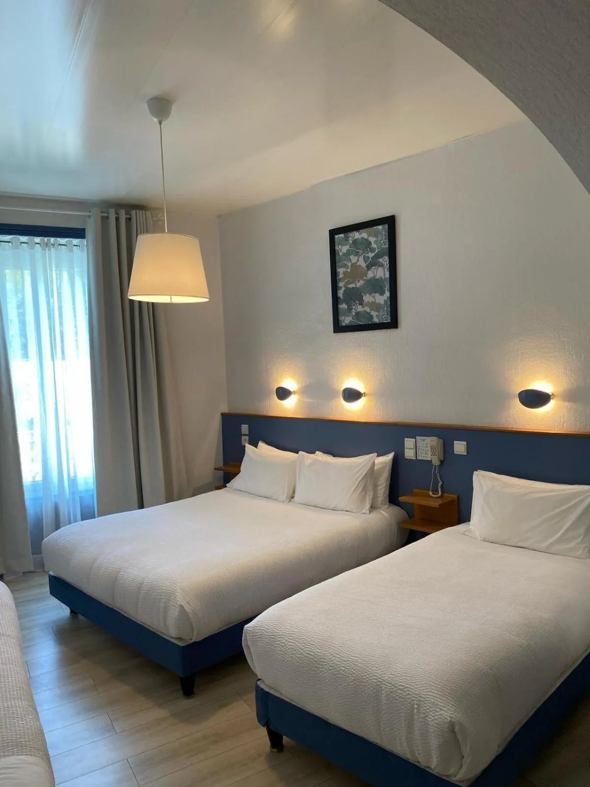 Photo of the whole room, Bed in Logis Hôtel Restaurant Grand Hôtel de Lyon