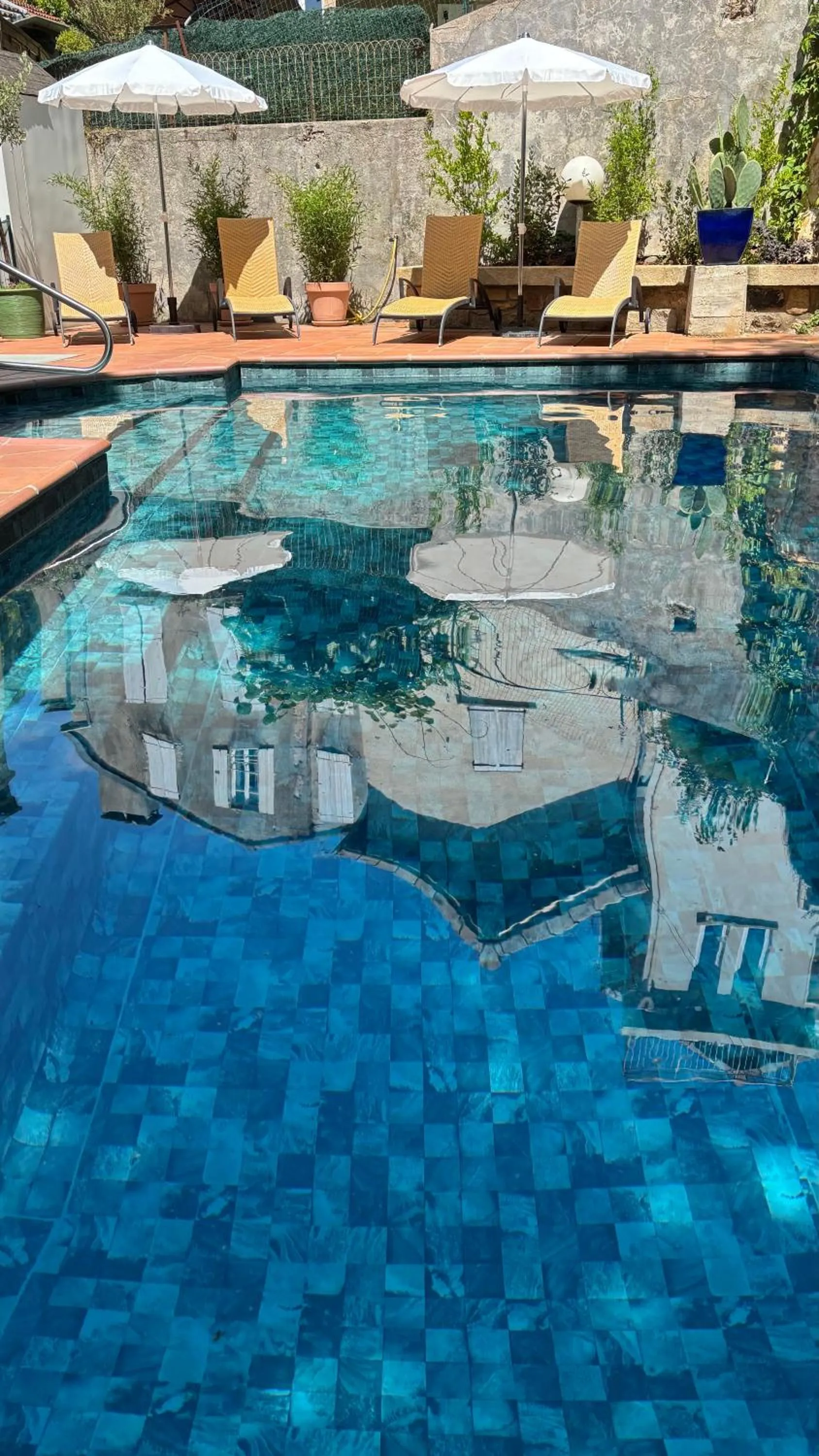 Swimming pool in Logis Hôtel Restaurant Grand Hôtel de Lyon