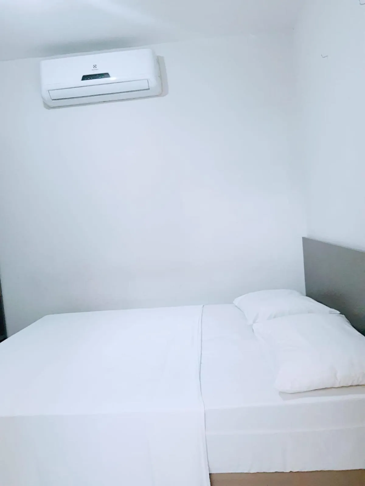 Bed in Pousada Tambaú