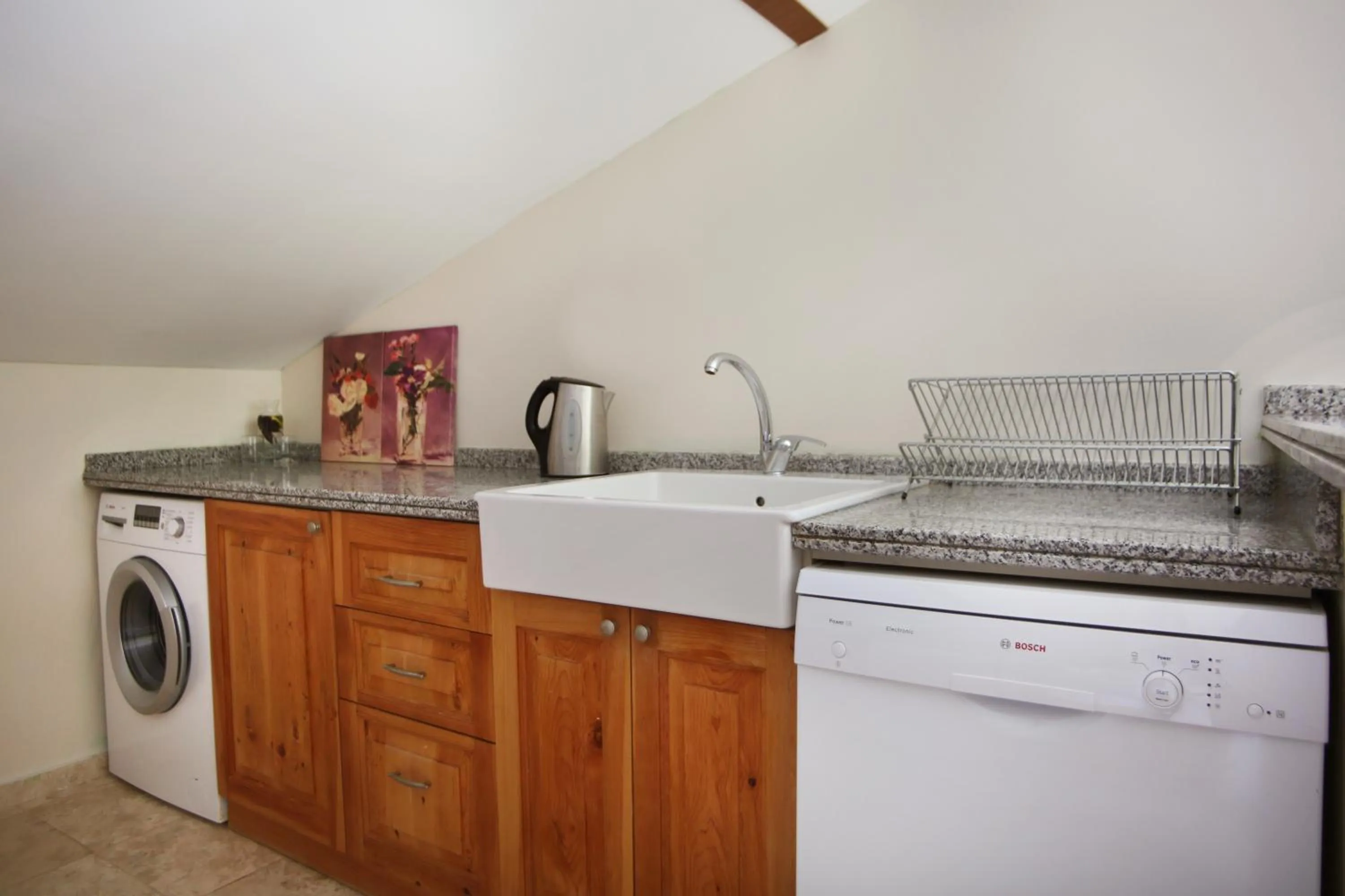 Kitchen or kitchenette in Saylam Suites