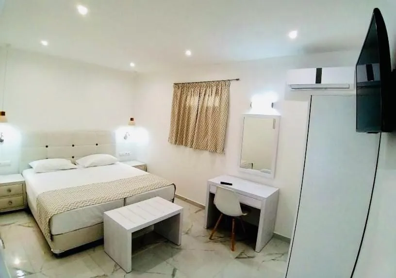 Bed in Limnionas Bay Village Hotel