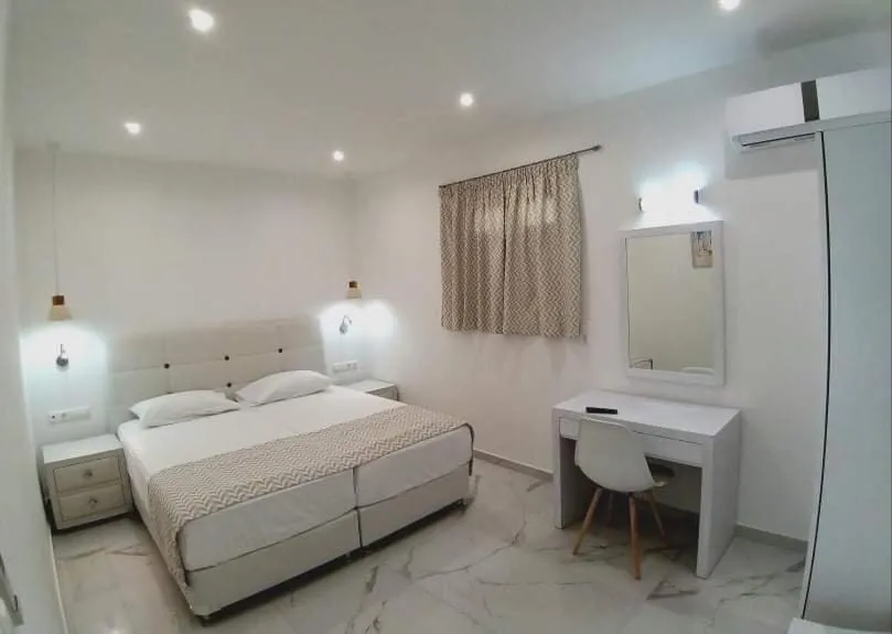 Bed in Limnionas Bay Village Hotel