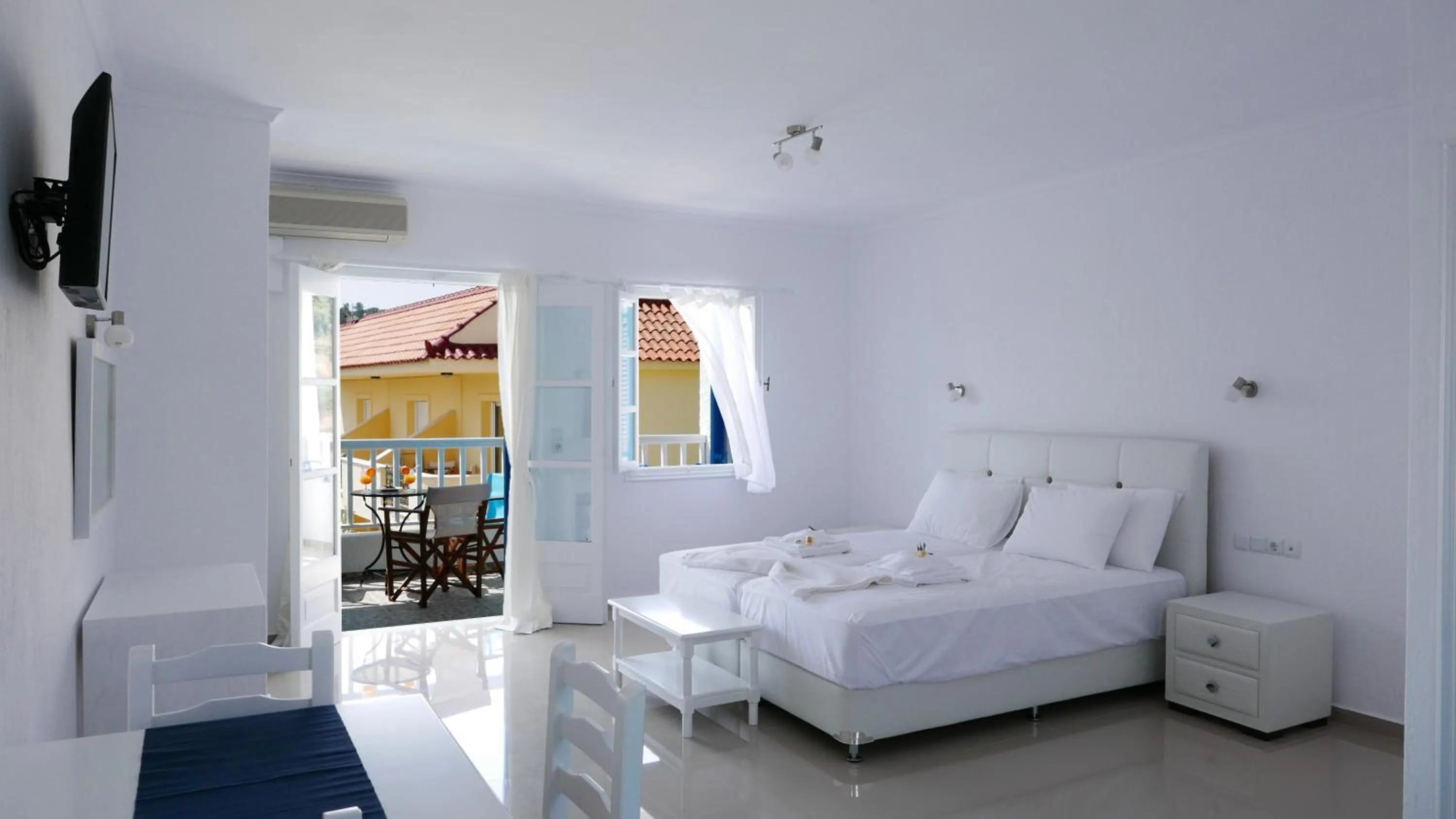 Bed in Limnionas Bay Village Hotel