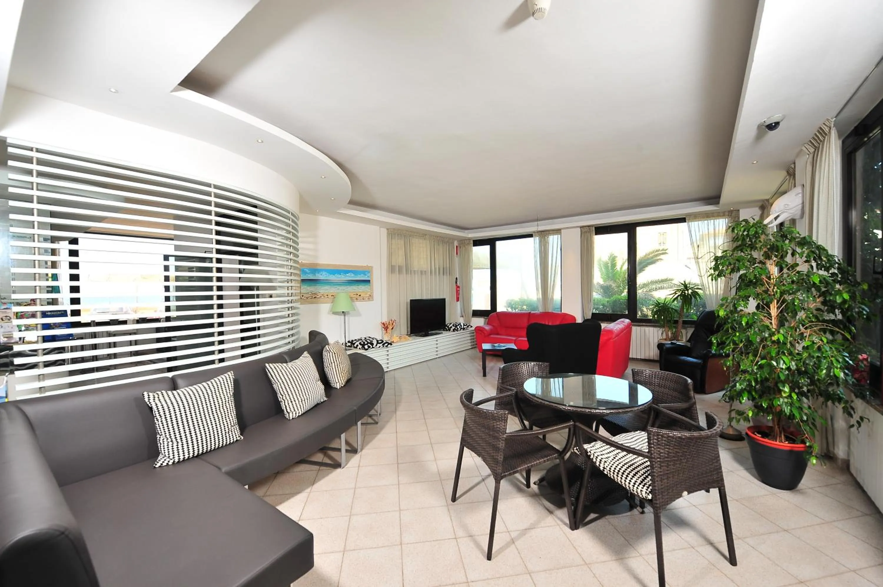 Communal lounge/ TV room in Hotel il Delfino