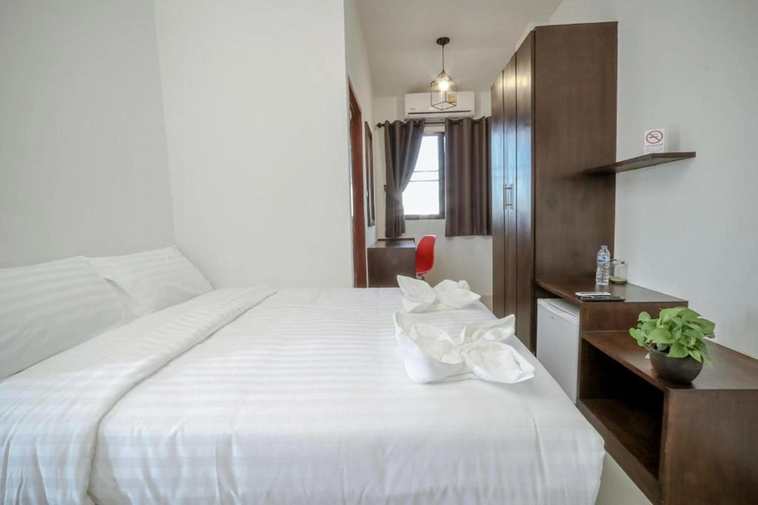 Bed in Hotel Wualai by CMStay