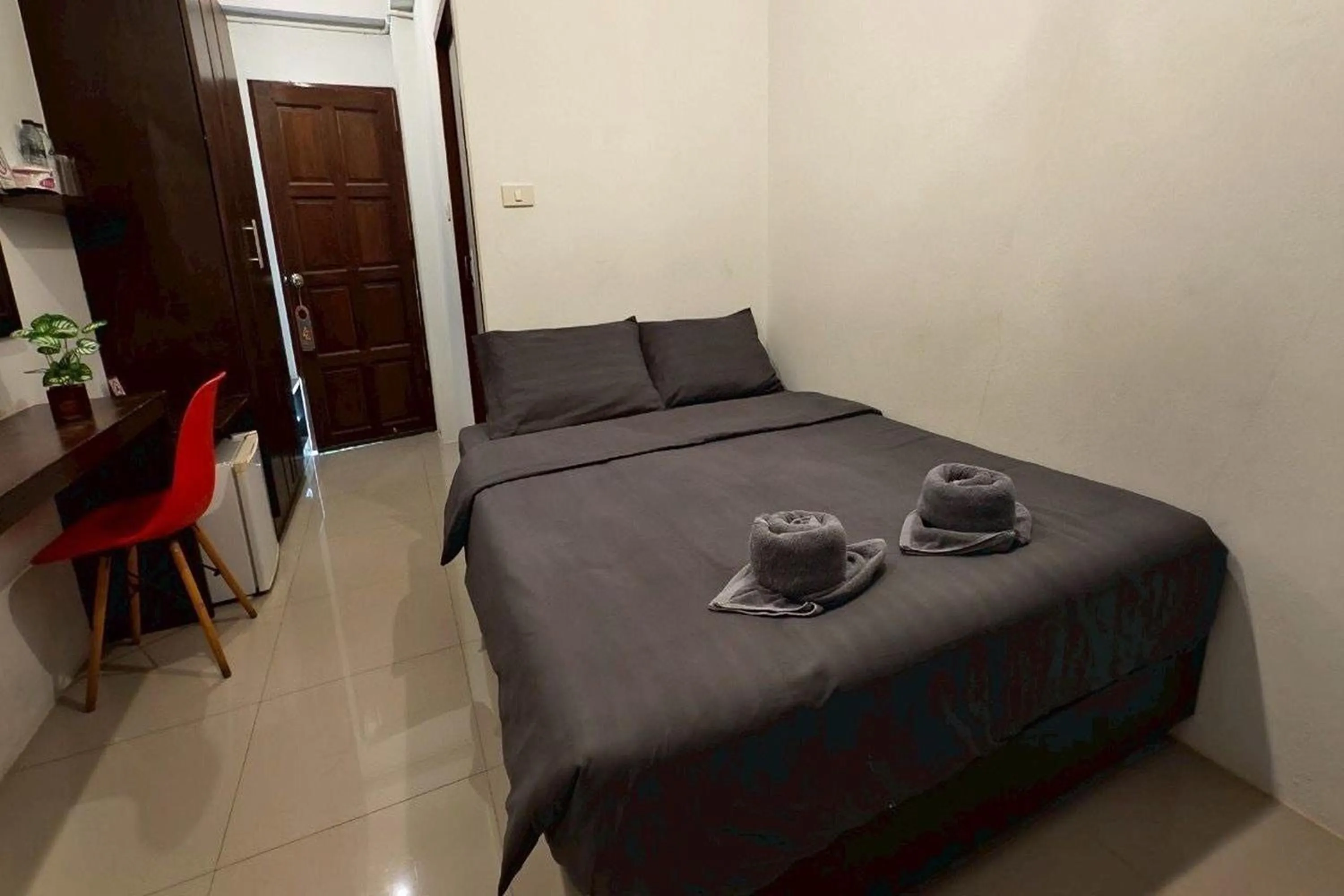 Bed in Hotel Wualai by CMStay