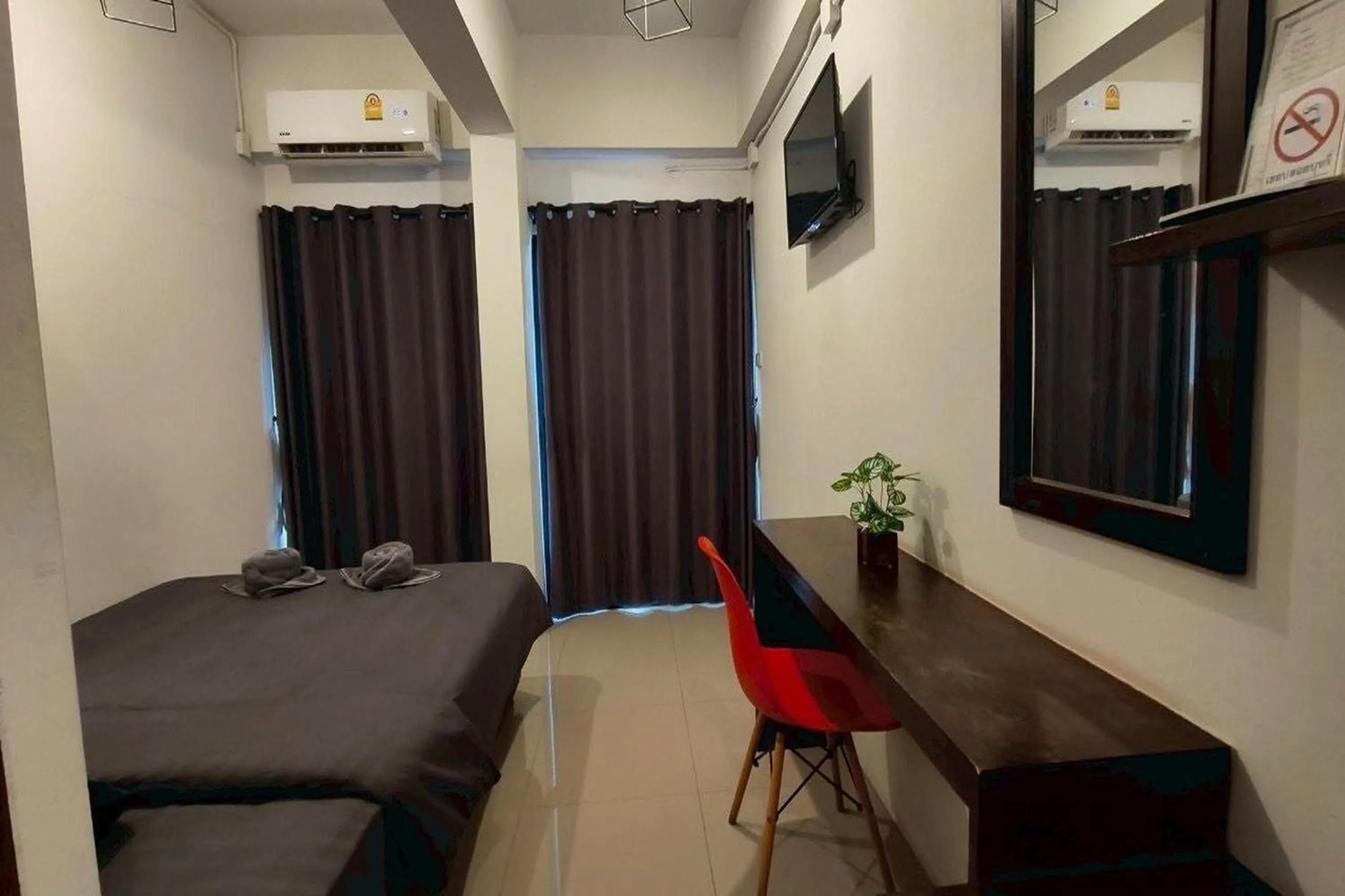 Bed in Hotel Wualai by CMStay