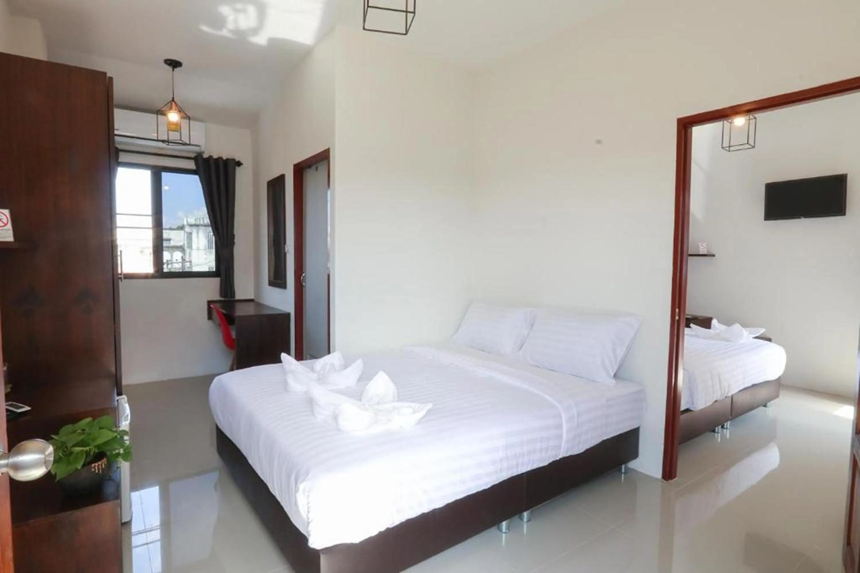 Bed in Hotel Wualai by CMStay