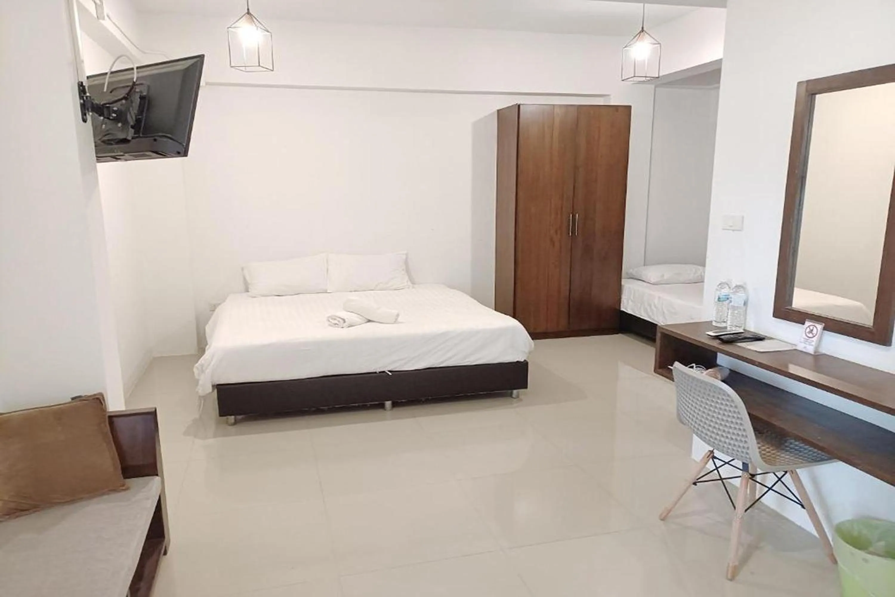 Bed in Hotel Wualai by CMStay