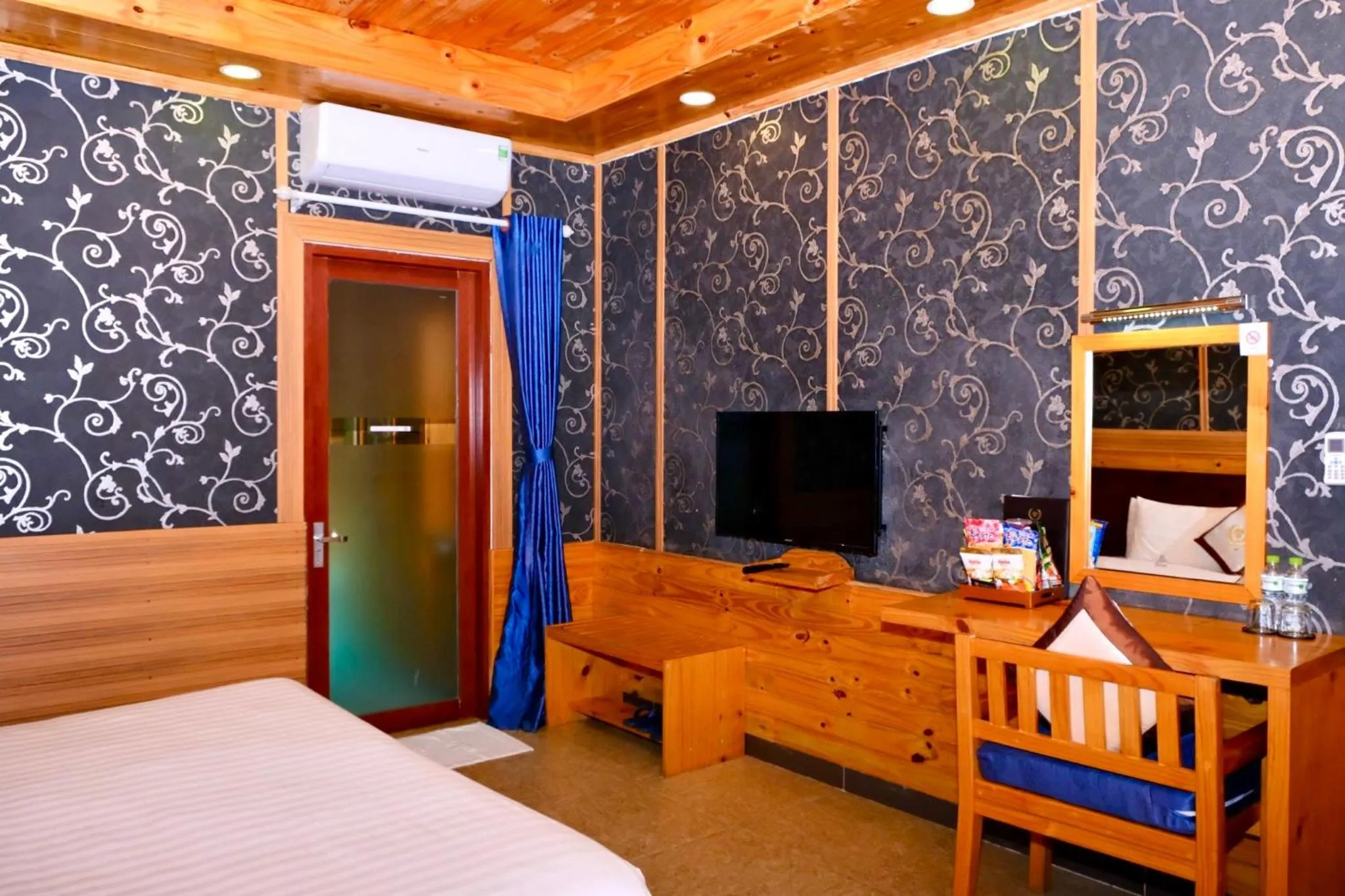 Living room, Bed in Tan Son Nhat Con Dao Resort