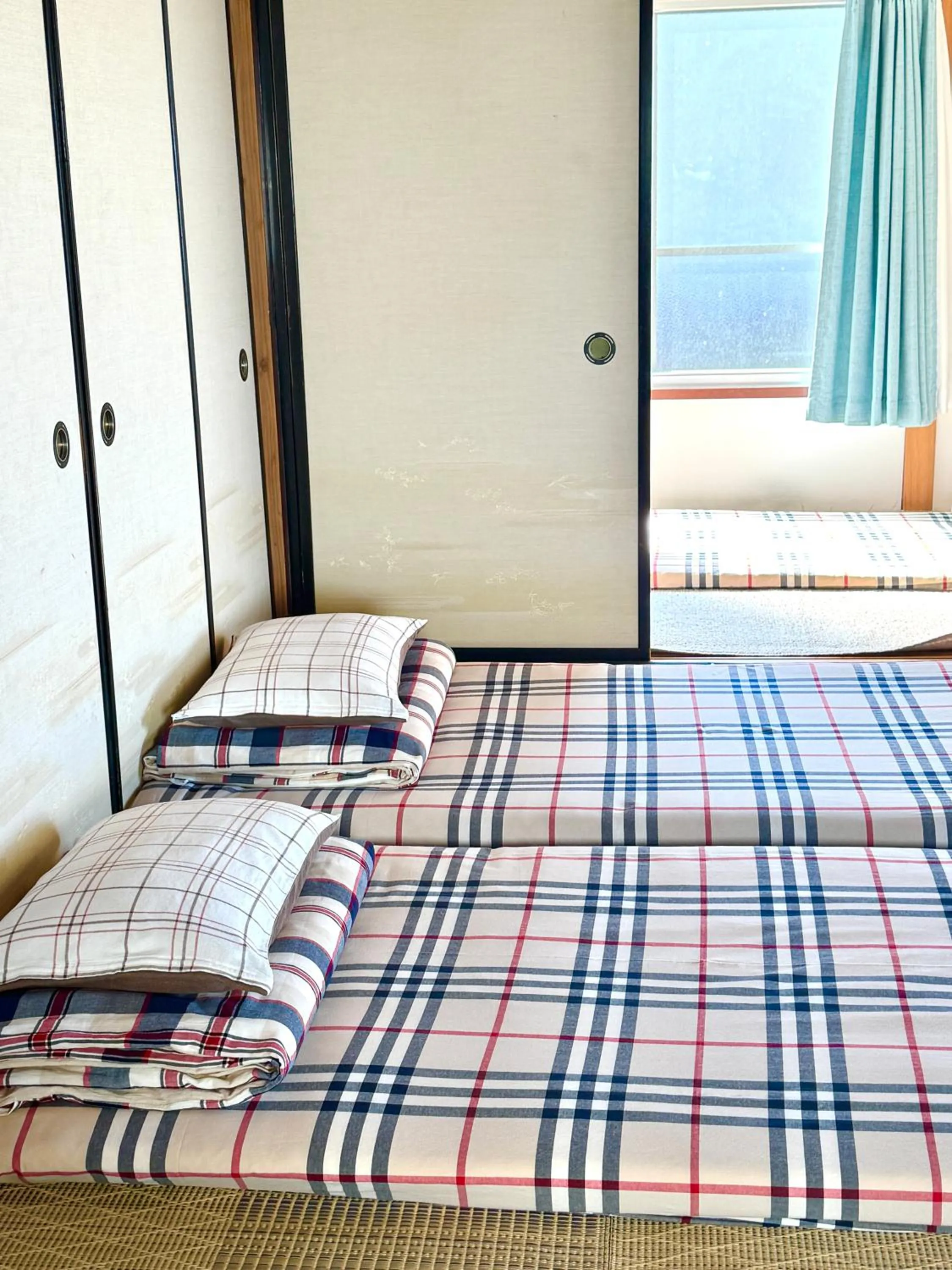 Bed in Izu Hokkawa Seaside Guesthouse 伊豆北川の家