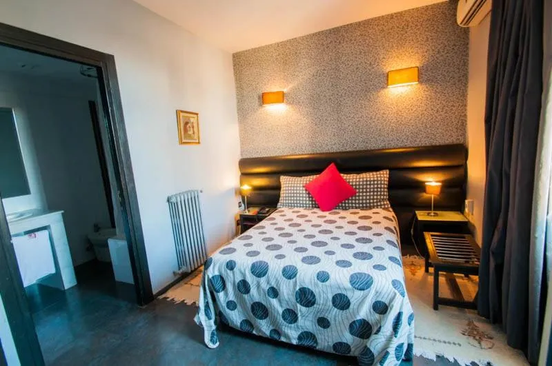 Bed in Hotel De La Paix