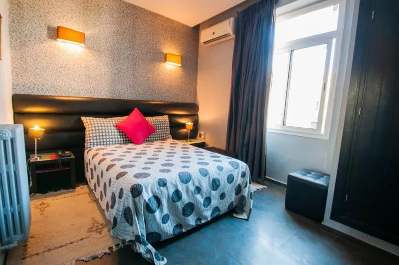 Bed in Hotel De La Paix