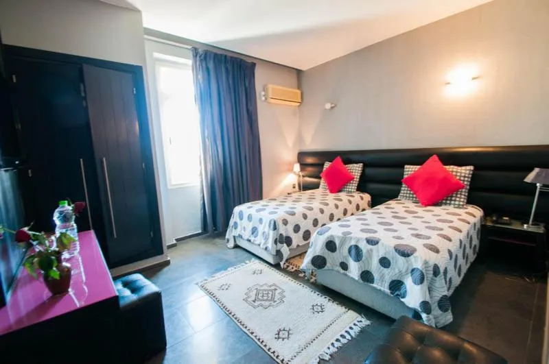 Bed in Hotel De La Paix