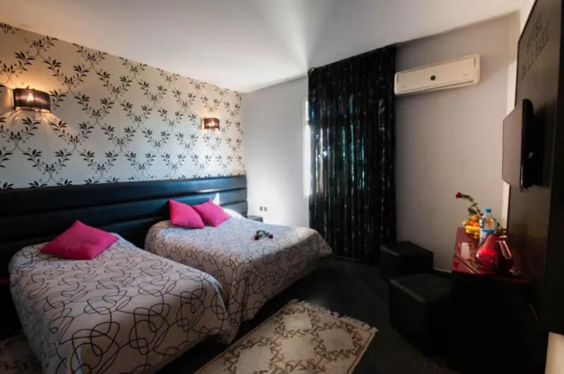 Bed in Hotel De La Paix