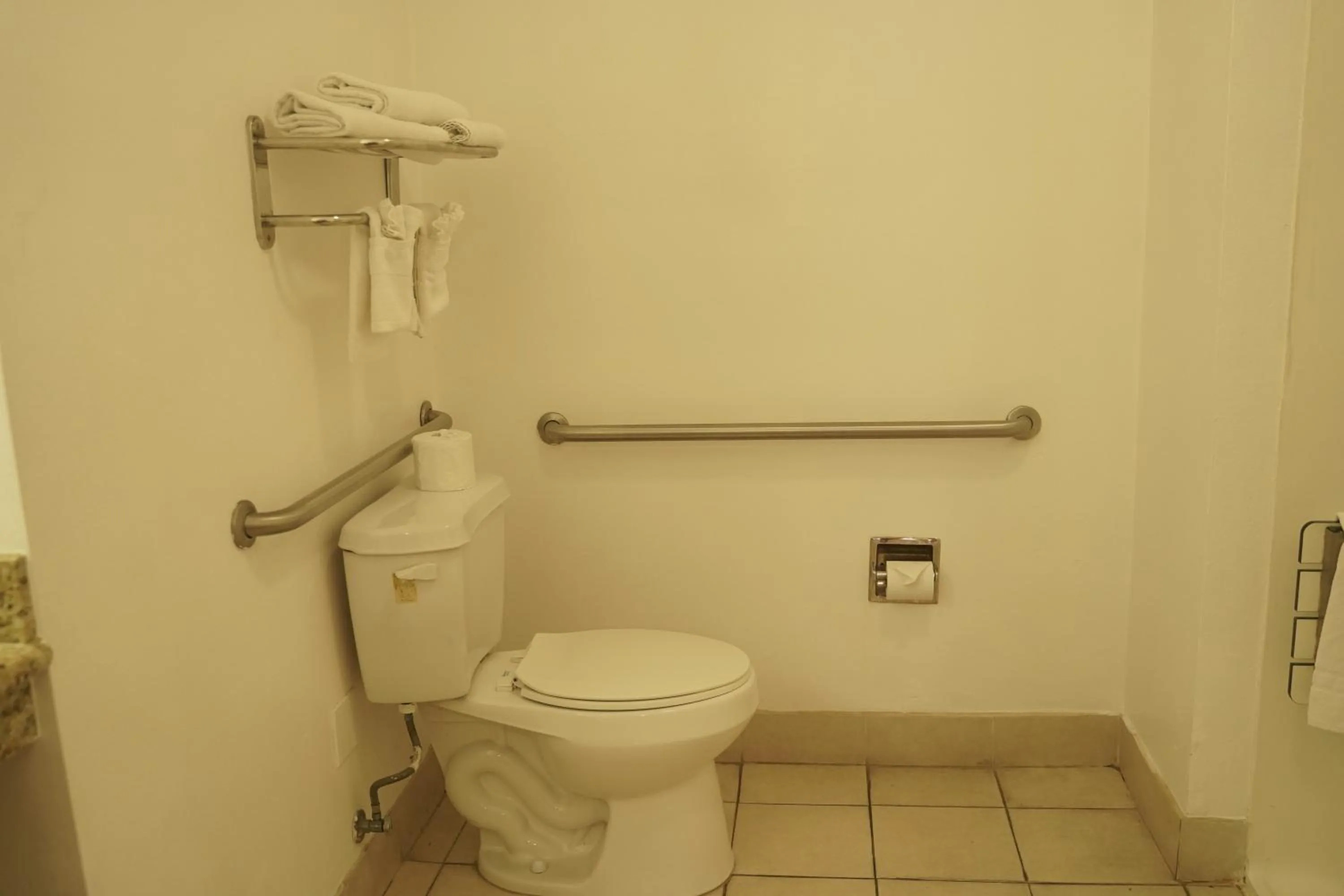 Toilet in Harbor Inn & Suites