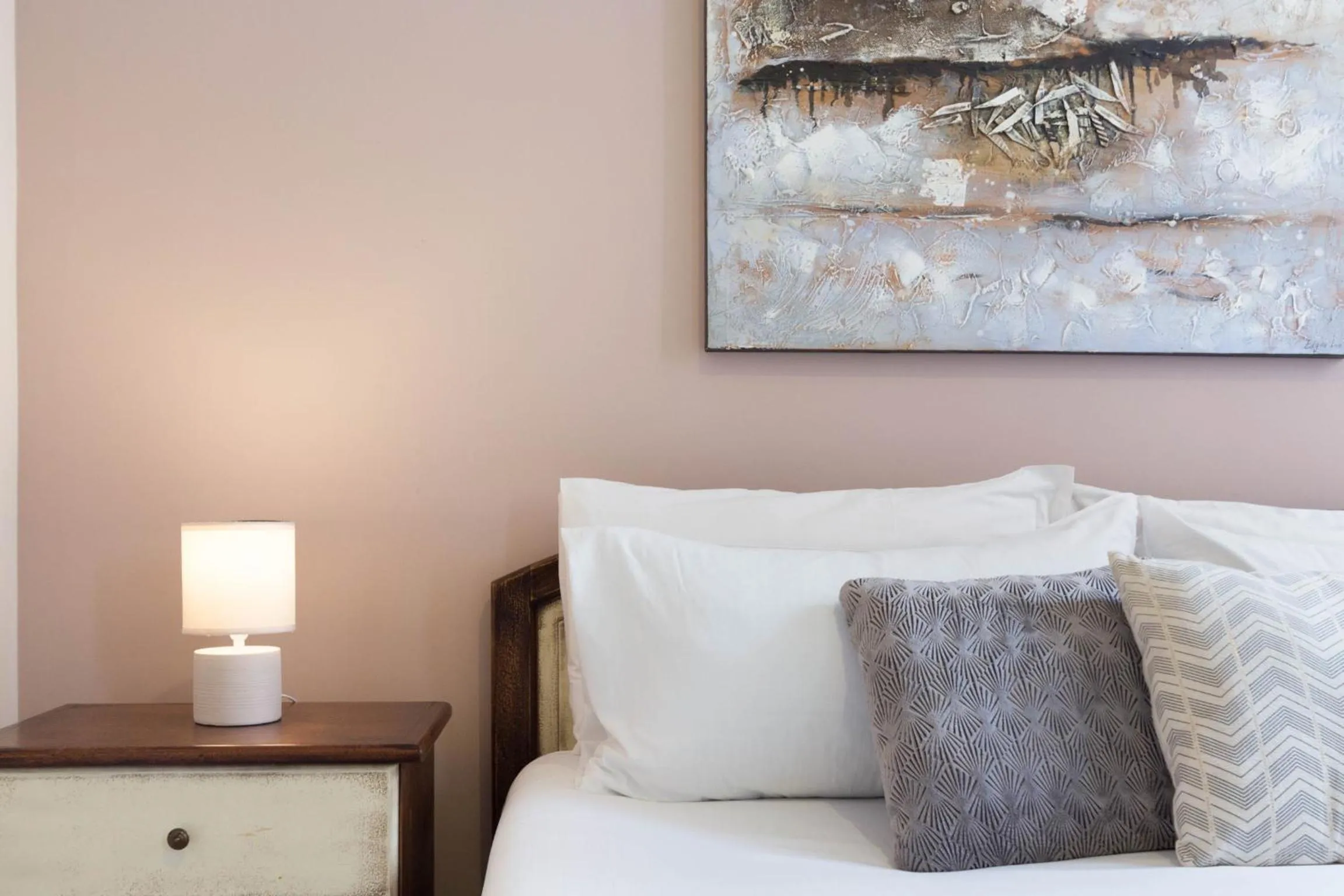 Bed in Arcobaleno Rooms