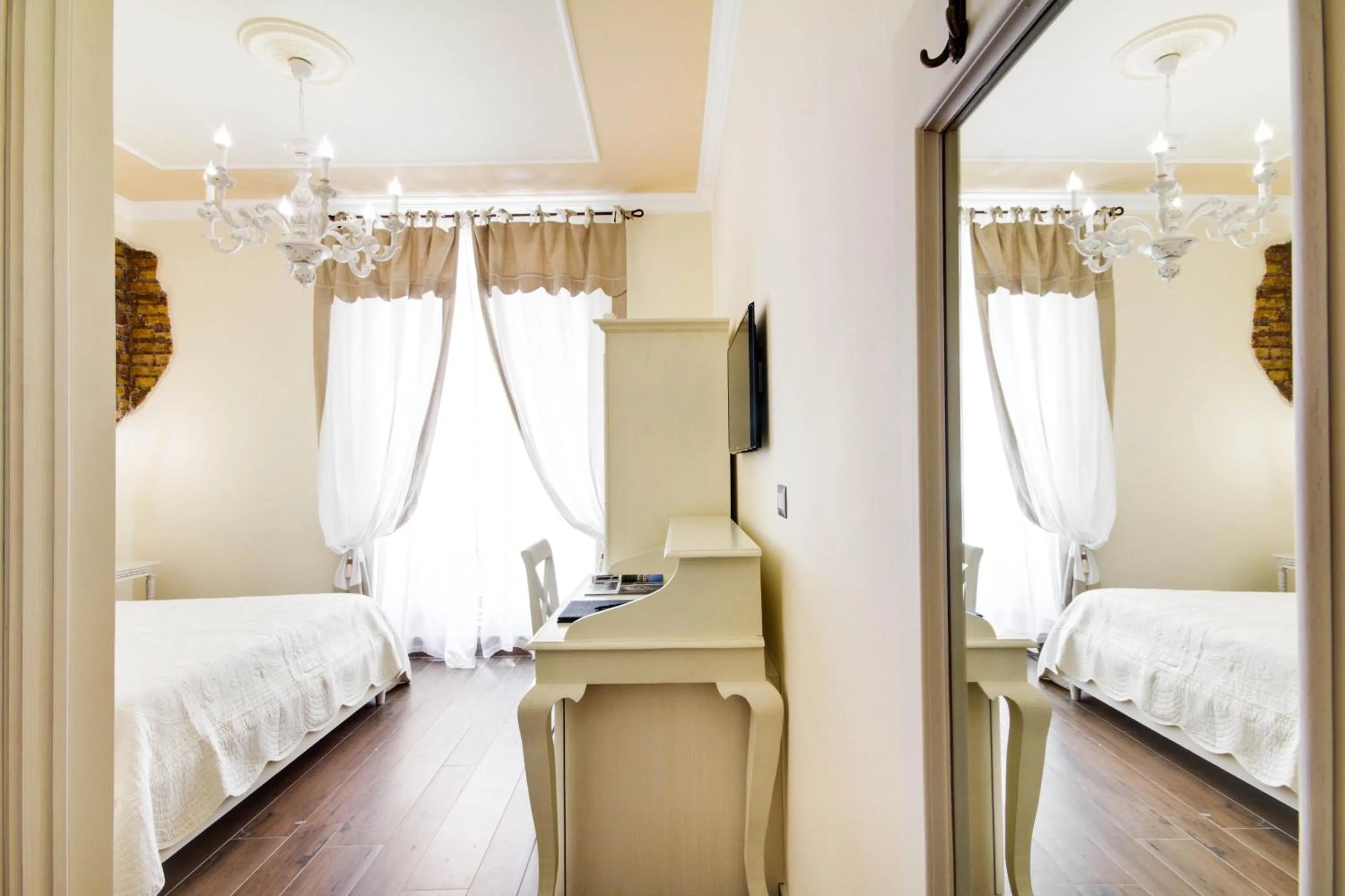 Bed in Lunaria Suites Rome Vaticano