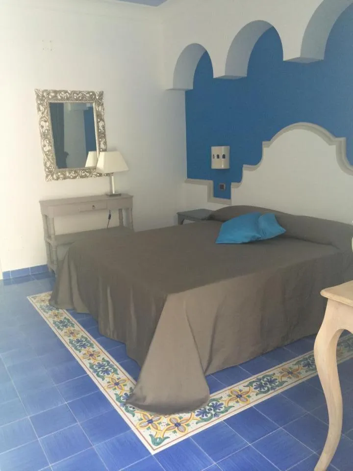 Bed in La Pineta Hotel Beach & Spa