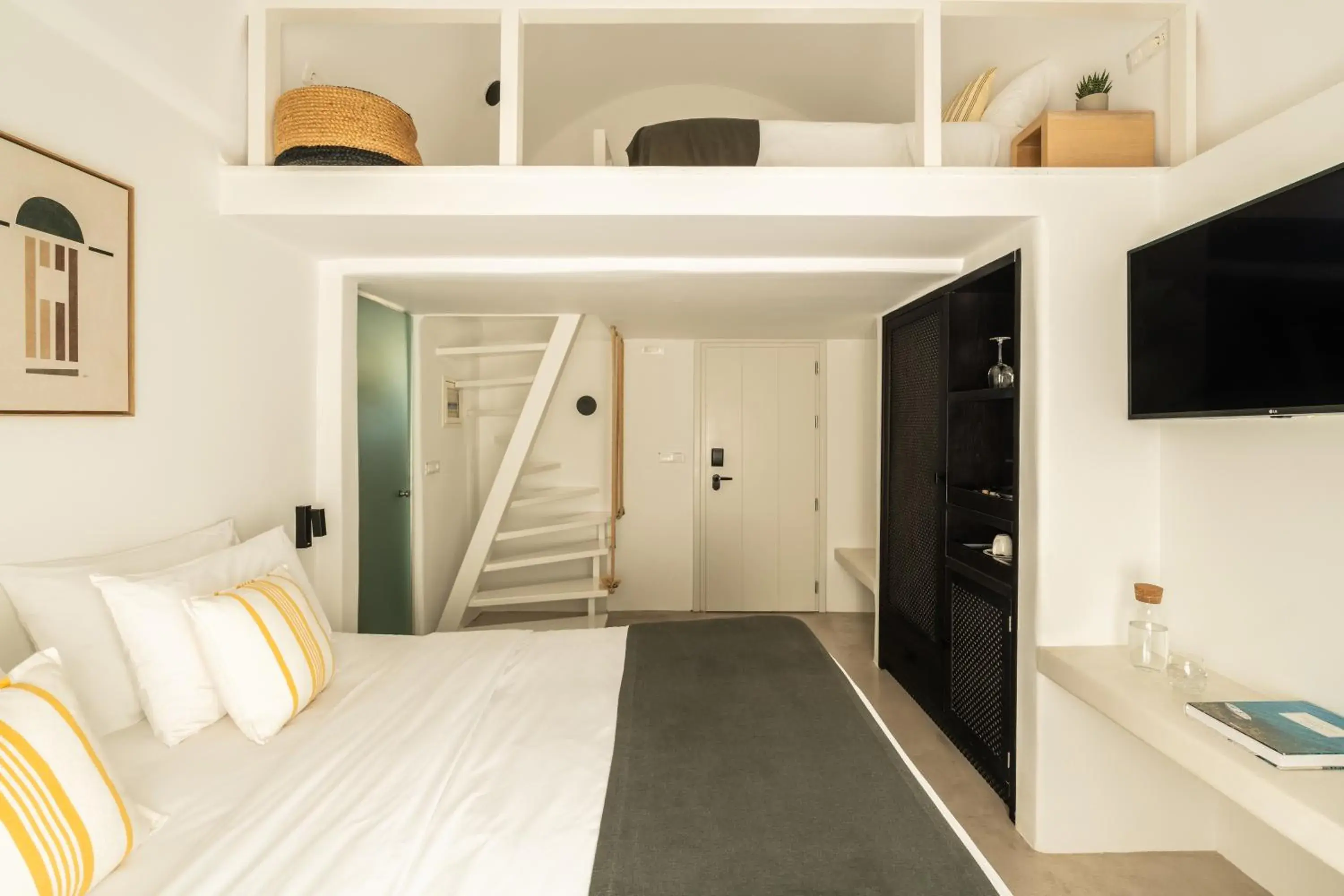 Deluxe Quadruple Room with Caldera View in Rocabella Santorini Hotel & Spa Deluxe Quadruple Room with Caldera View in Rocabella Santorini Hotel & Spa