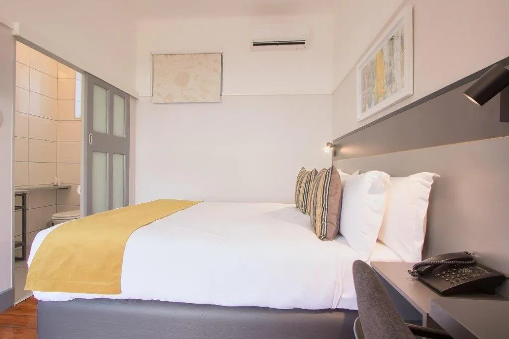 Toilet, Bed in THE Pretoria Hotel