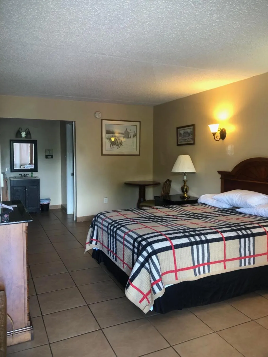 Bed in ANS INN & SUITES