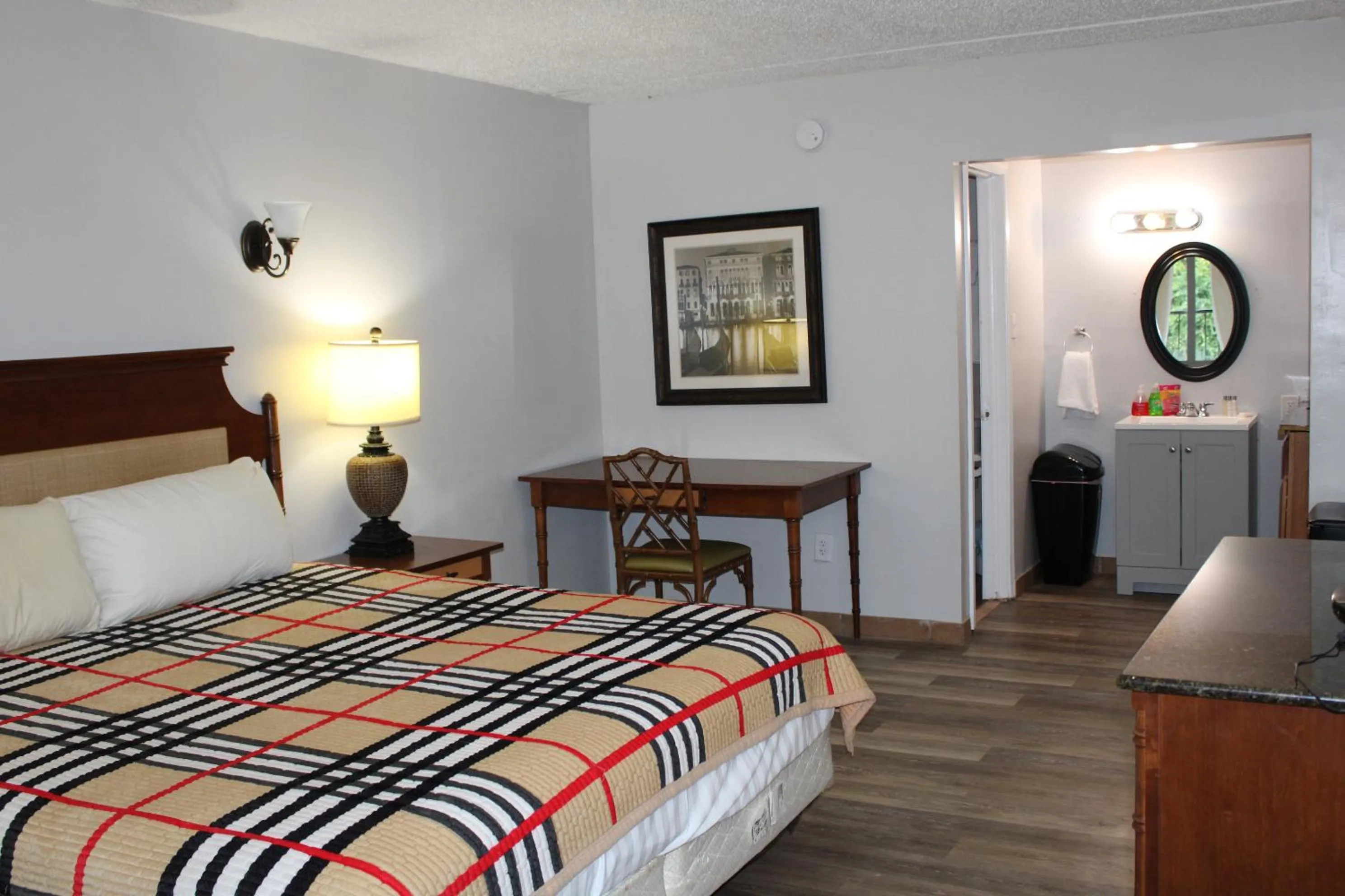 Bed in ANS INN & SUITES