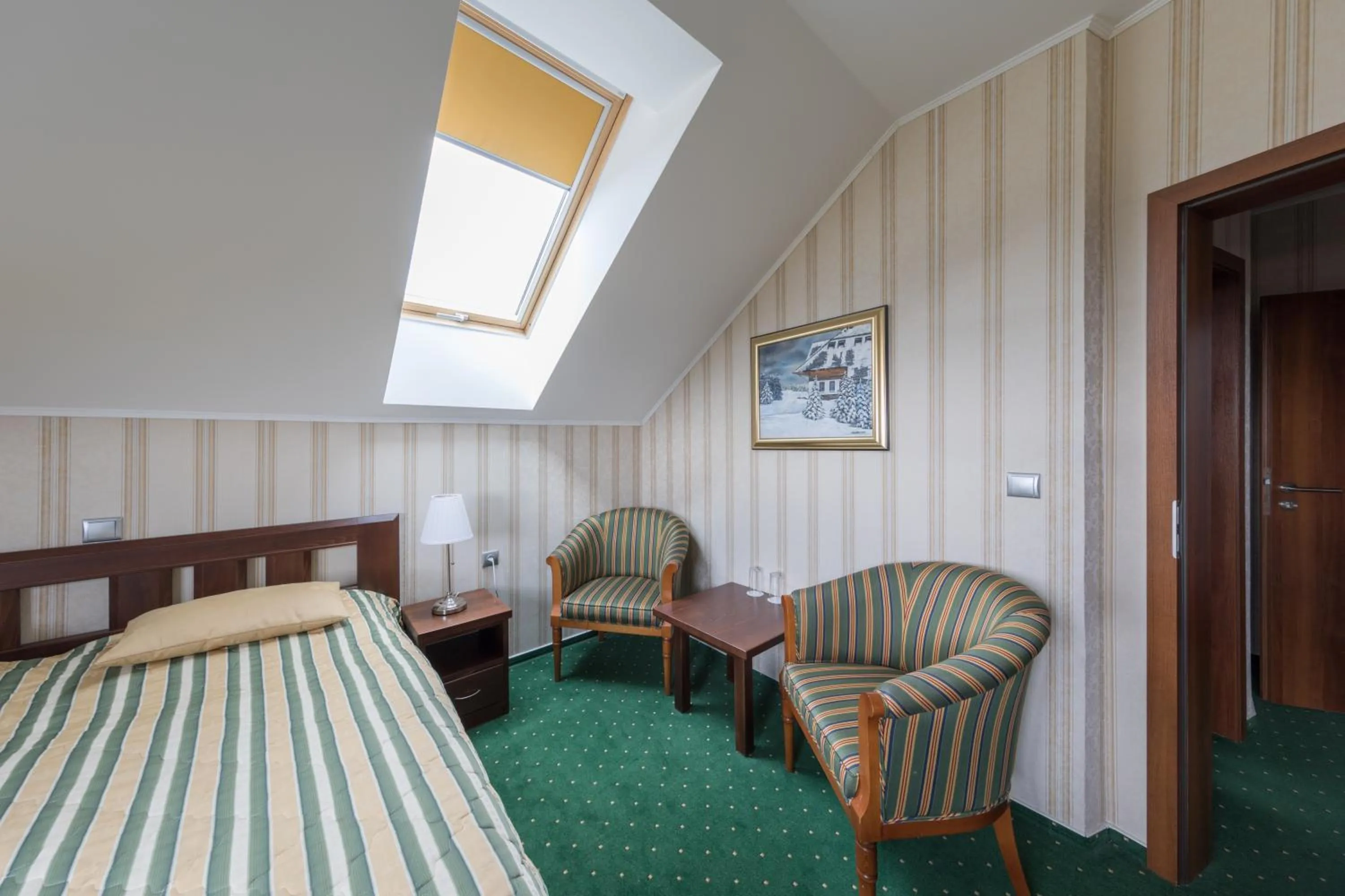 Living room, Bed in Hotel Krušnohorský Dvůr