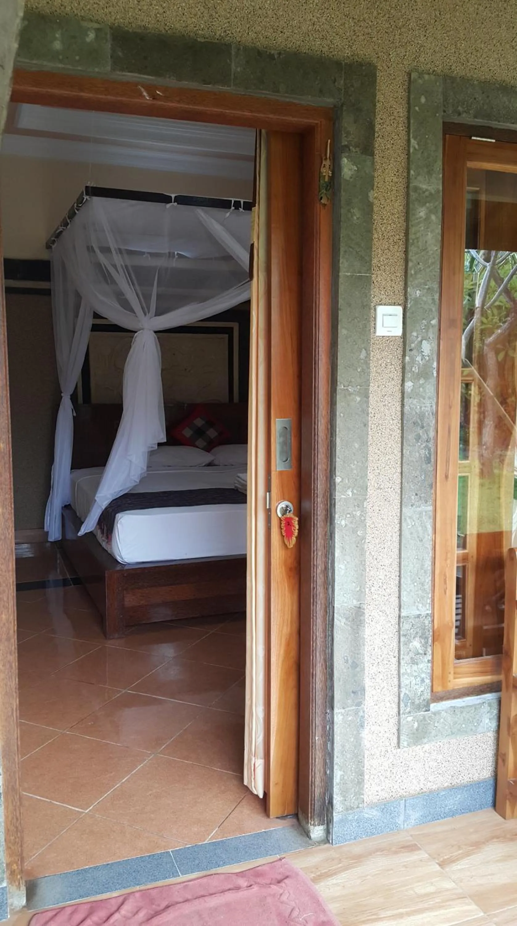 Balcony/Terrace, Bed in Trijaya Guest House Pemuteran