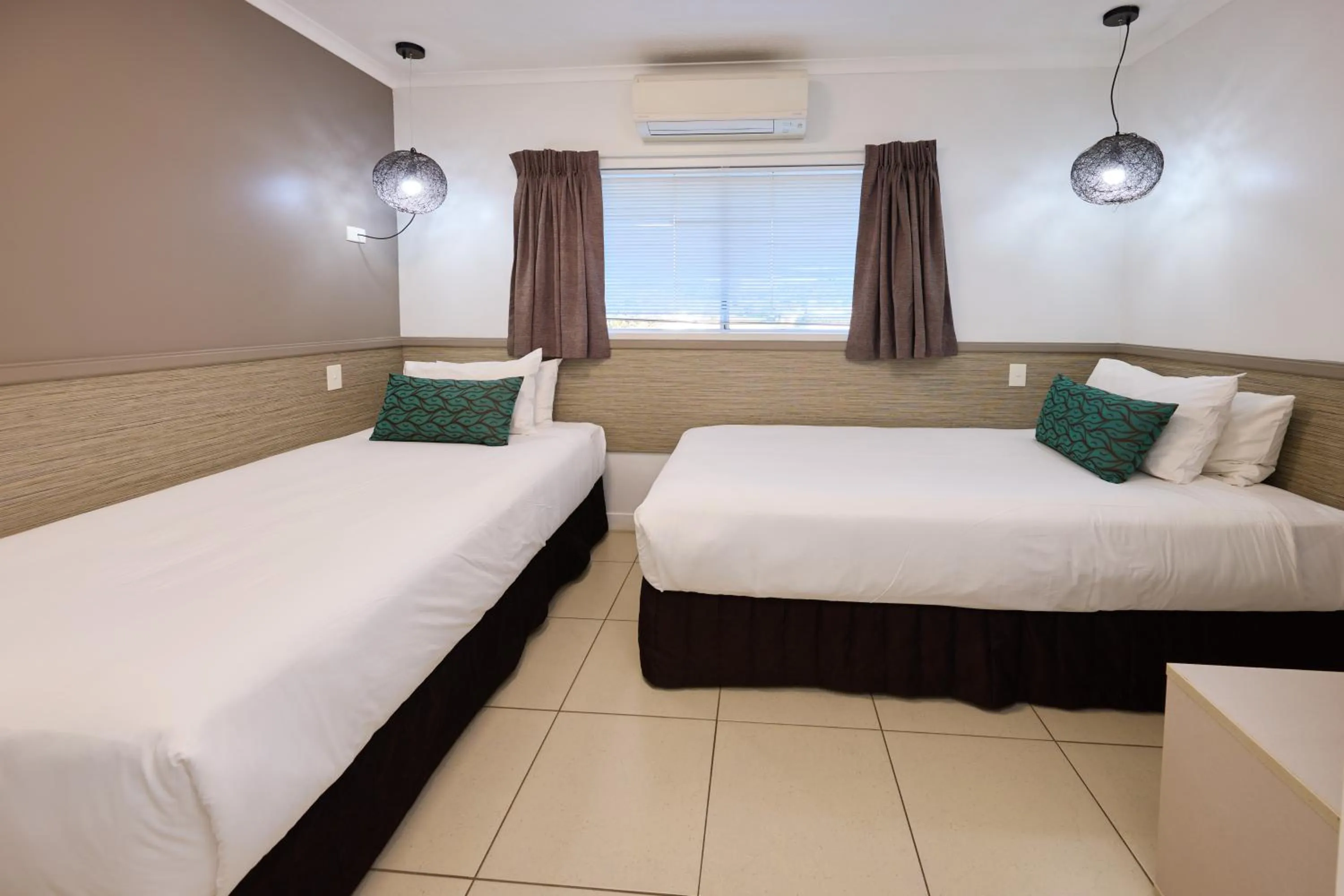 Bed in Castaways Resort & Spa On Mission Beach