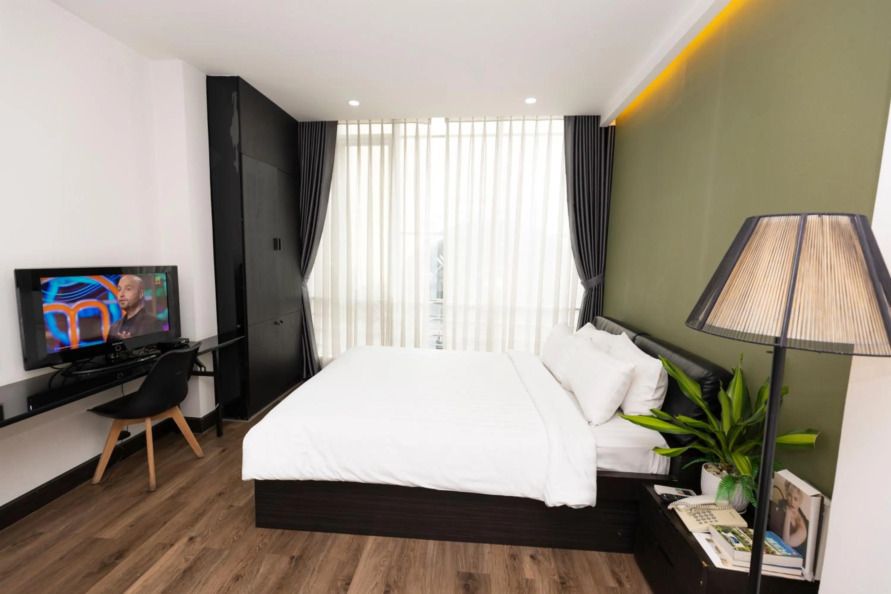 Communal lounge/ TV room, Bed in The One Premium Hotel