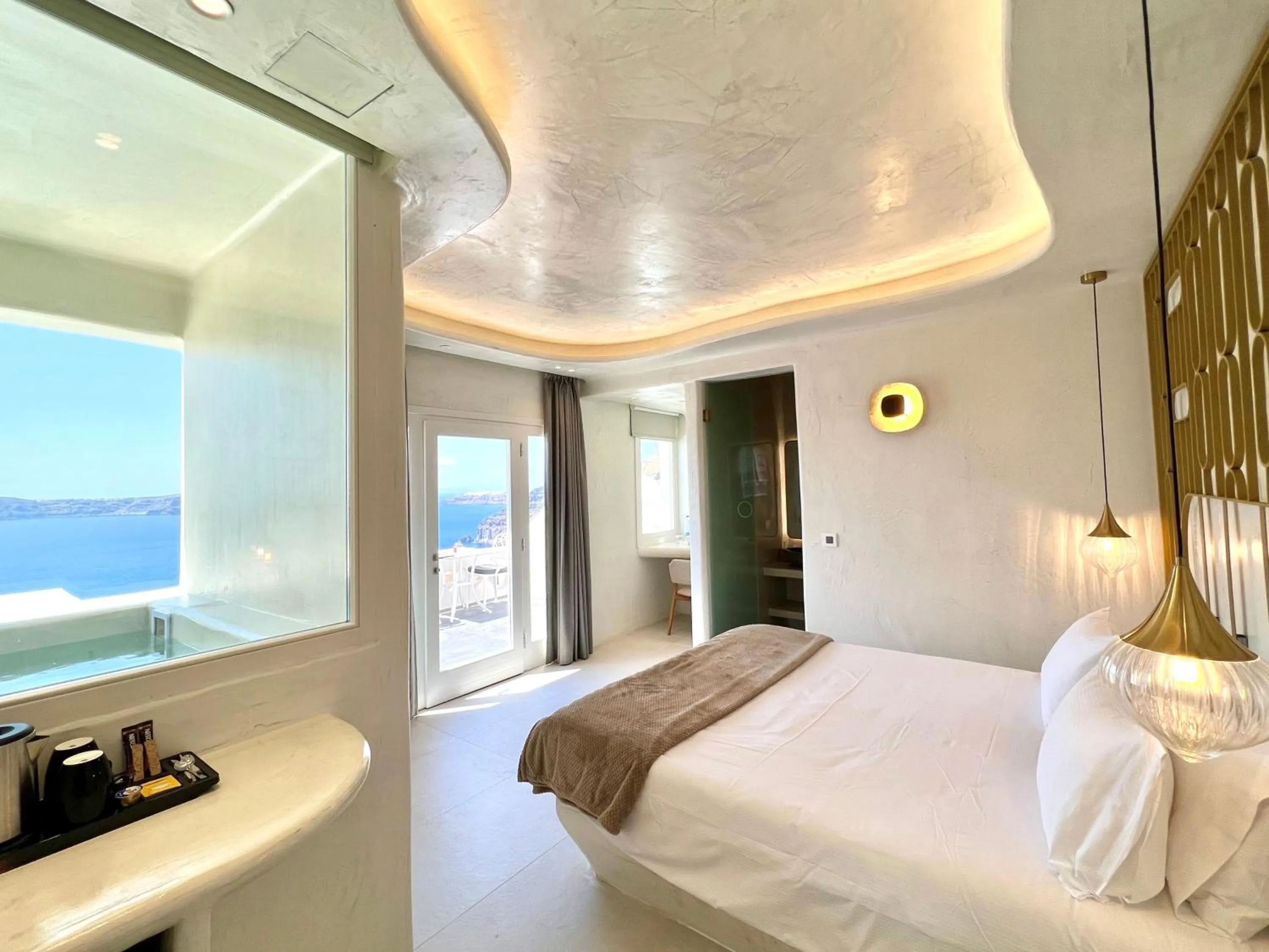 Bed in Athina Luxury Suites