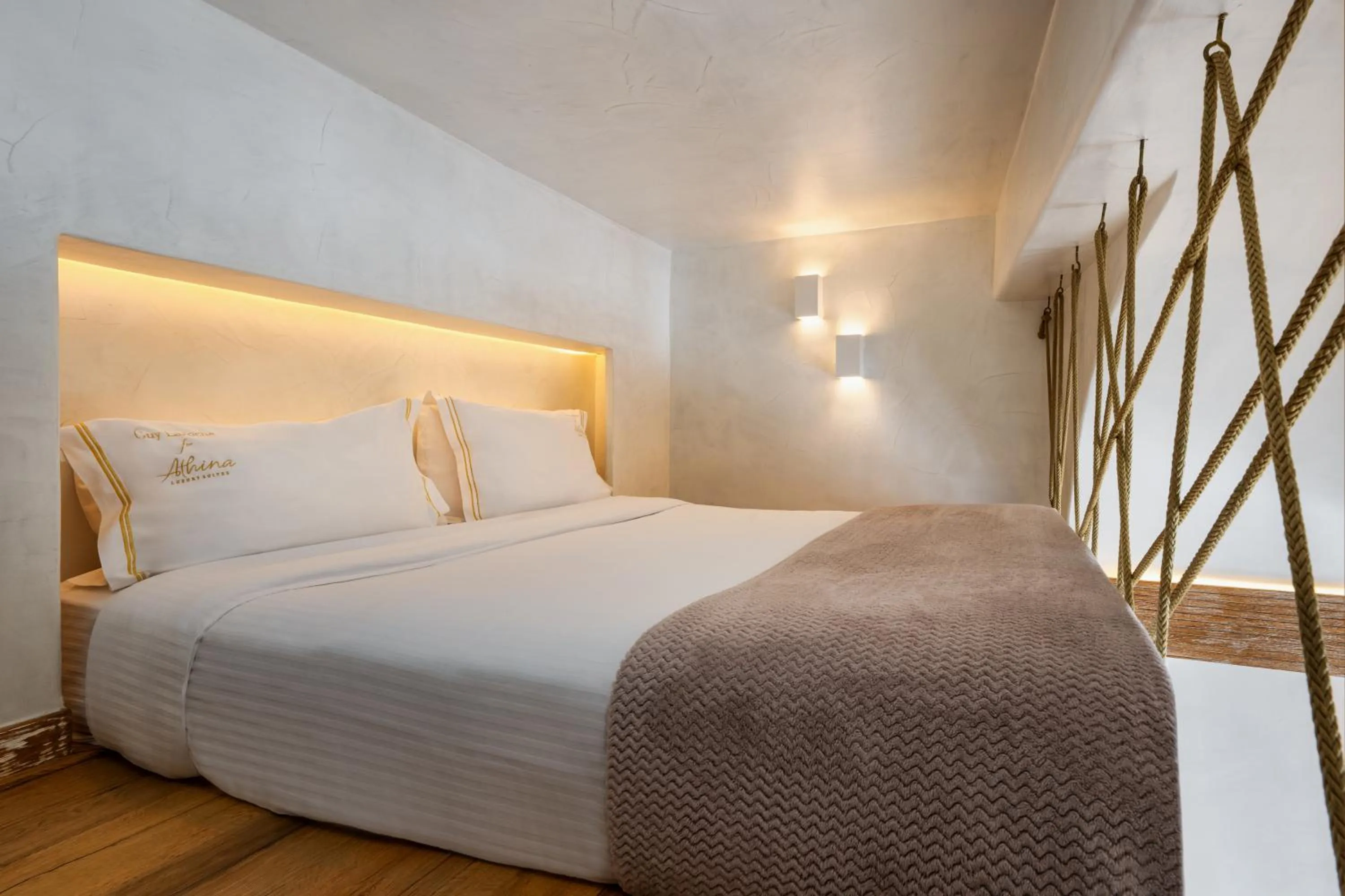 Bed in Athina Luxury Suites