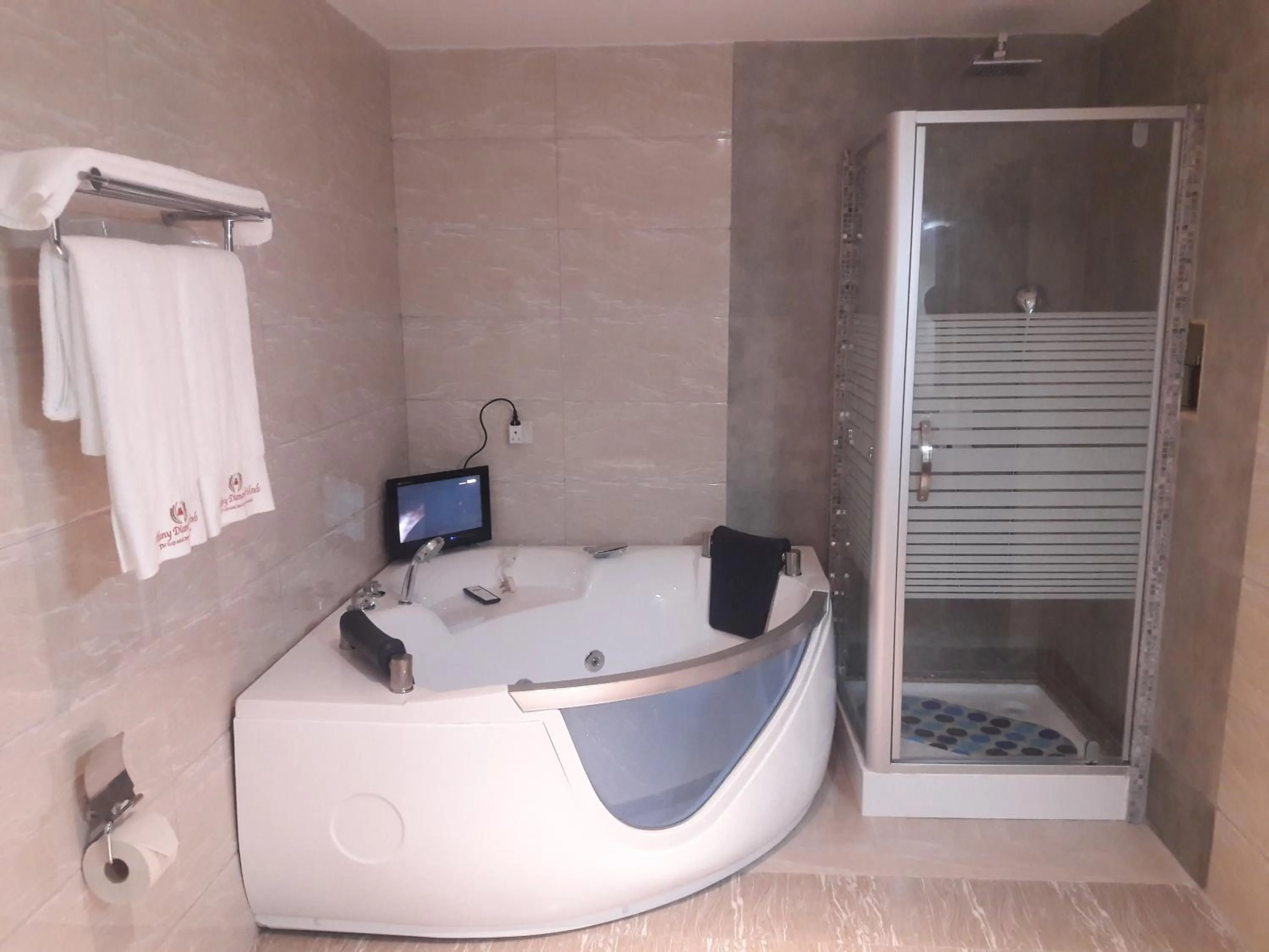 Bathroom in Tiffany Diamond Hotels LTD - Makunganya