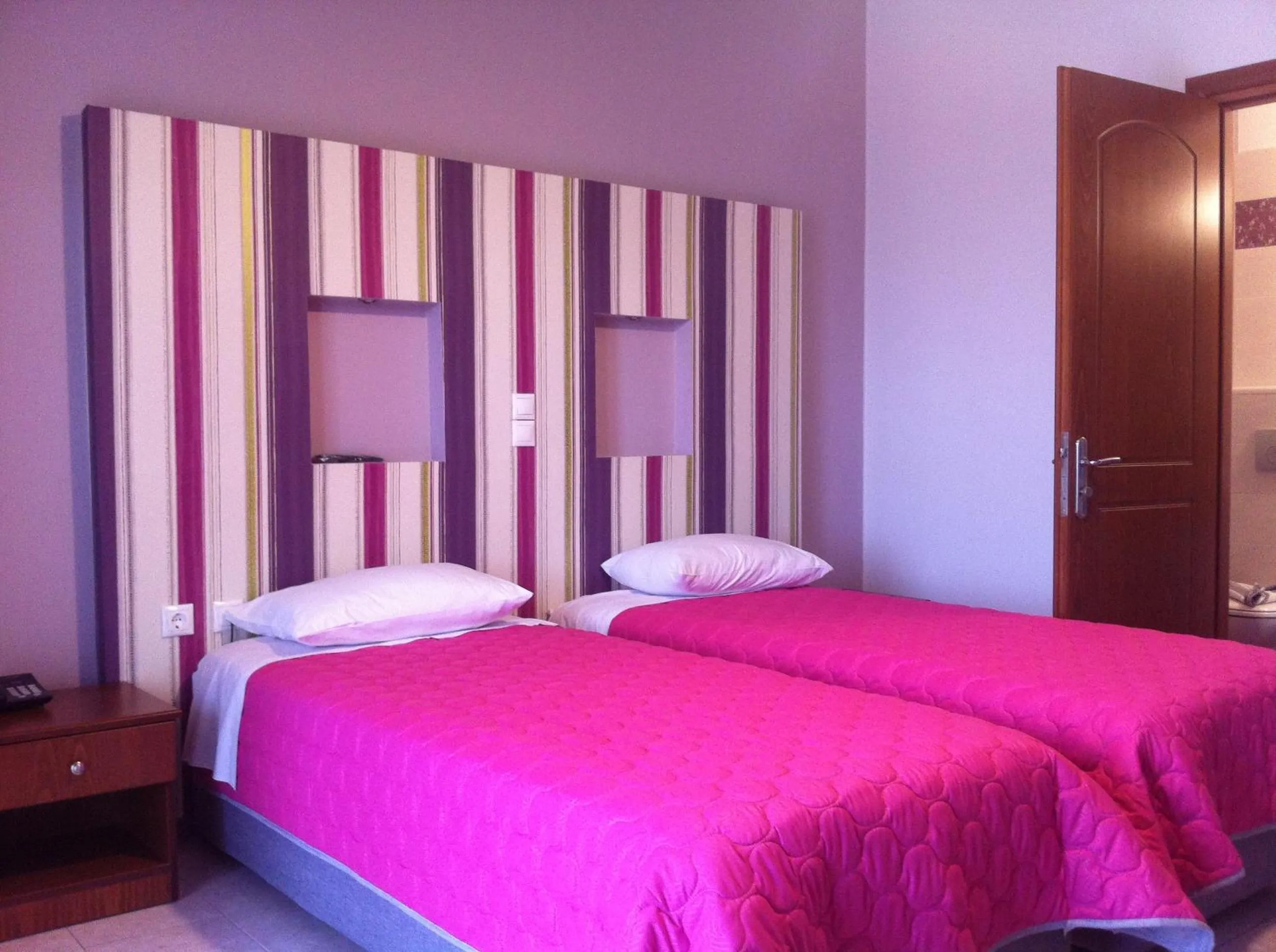 Bed in Elektra Hotel