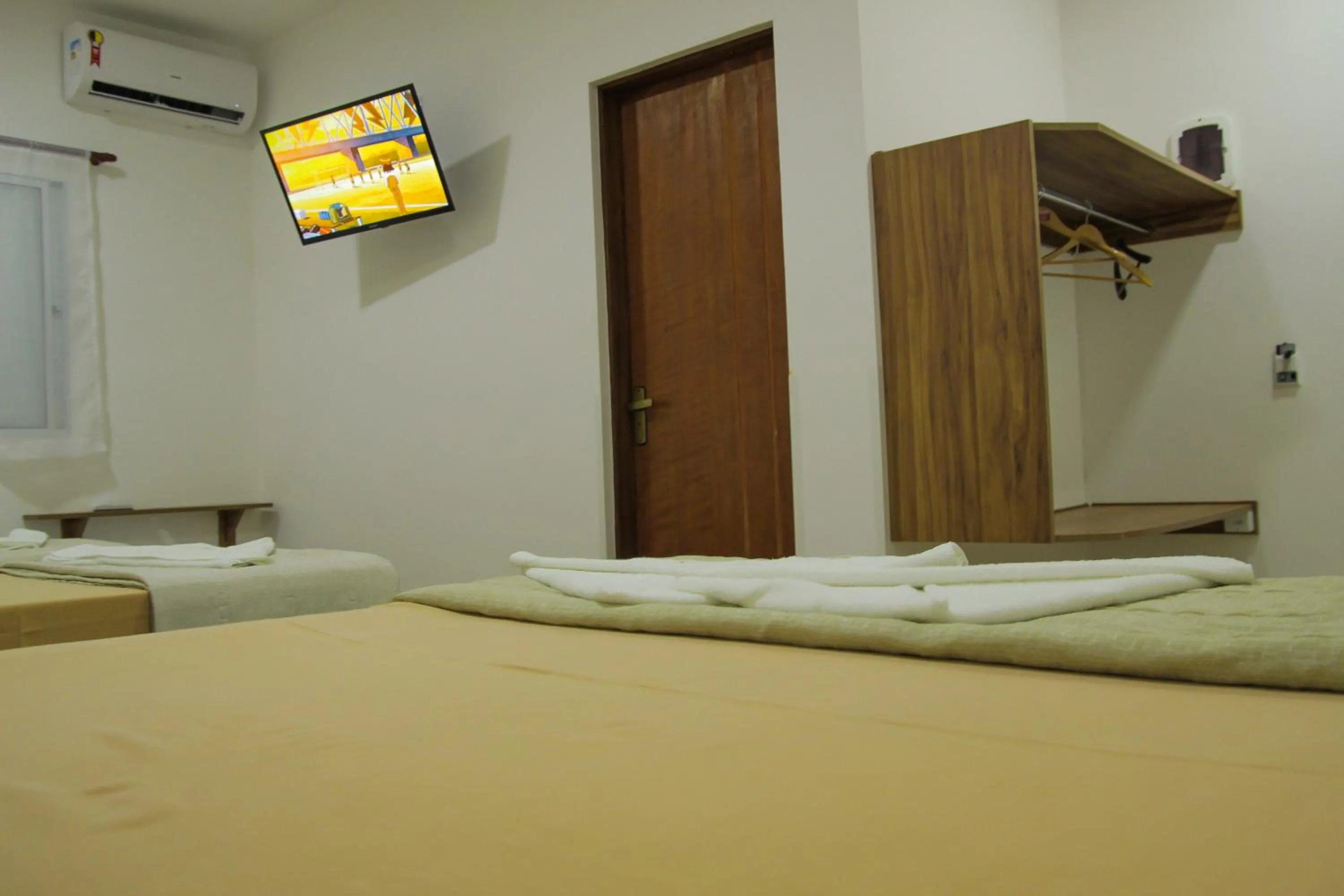 Bed in Pousada Parapuã