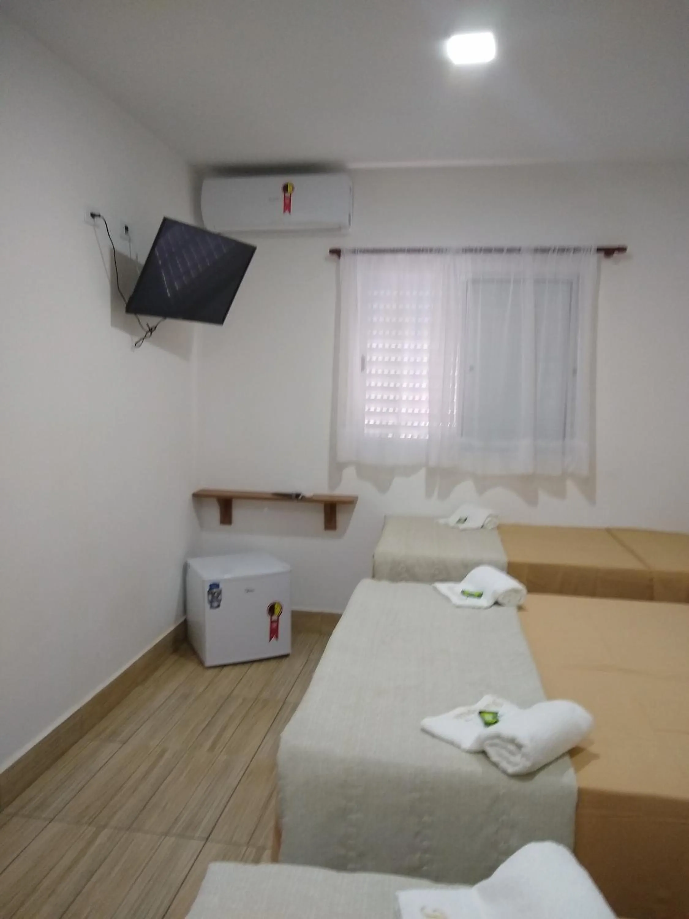 Bed in Pousada Parapuã