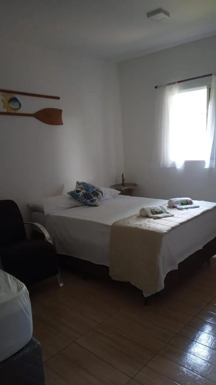 Bed in Pousada Parapuã